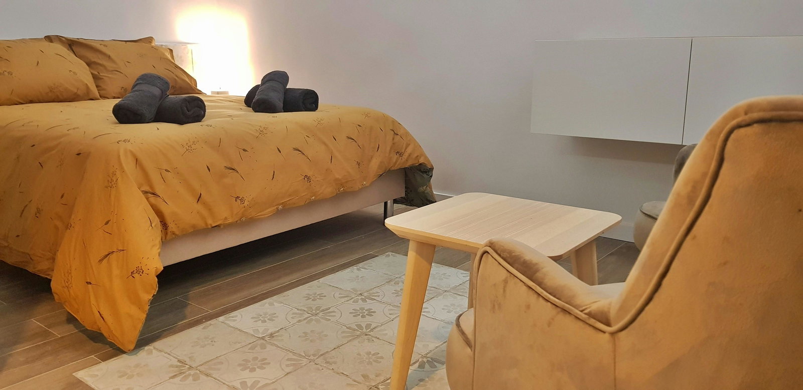 The bedroom features a queen-size bed
