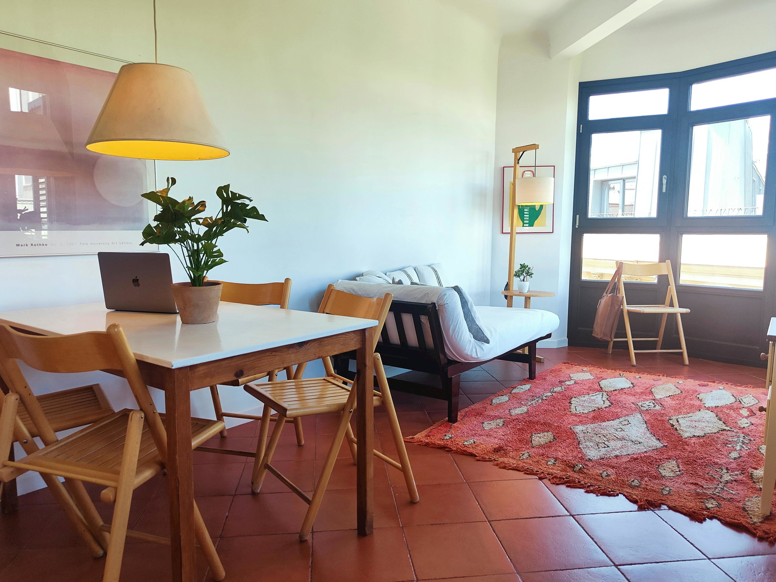 Bright and spacious living room filled with natural light — perfect for relaxing or working.