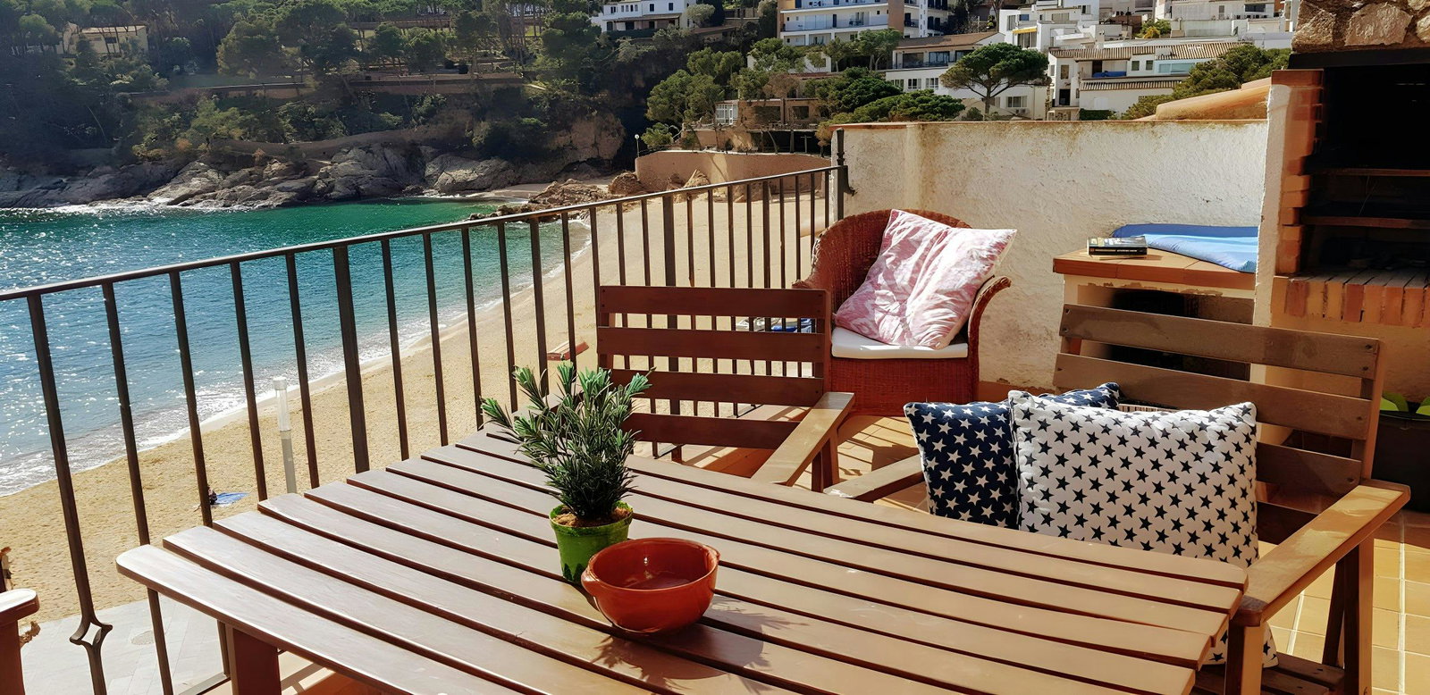 Enjoy breathtaking views of the Mediterranean Sea from the spacious terrace, perfect for al fresco dining. The terrace features a wooden table and chairs, and a built-in barbecue. The terrace is the ideal spot to unwind and soak up the sun.