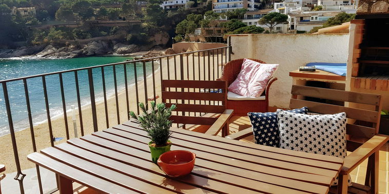 Enjoy breathtaking views of the Mediterranean Sea from the spacious terrace, perfect for al fresco dining. The terrace features a wooden table and chairs, and a built-in barbecue. The terrace is the ideal spot to unwind and soak up the sun.