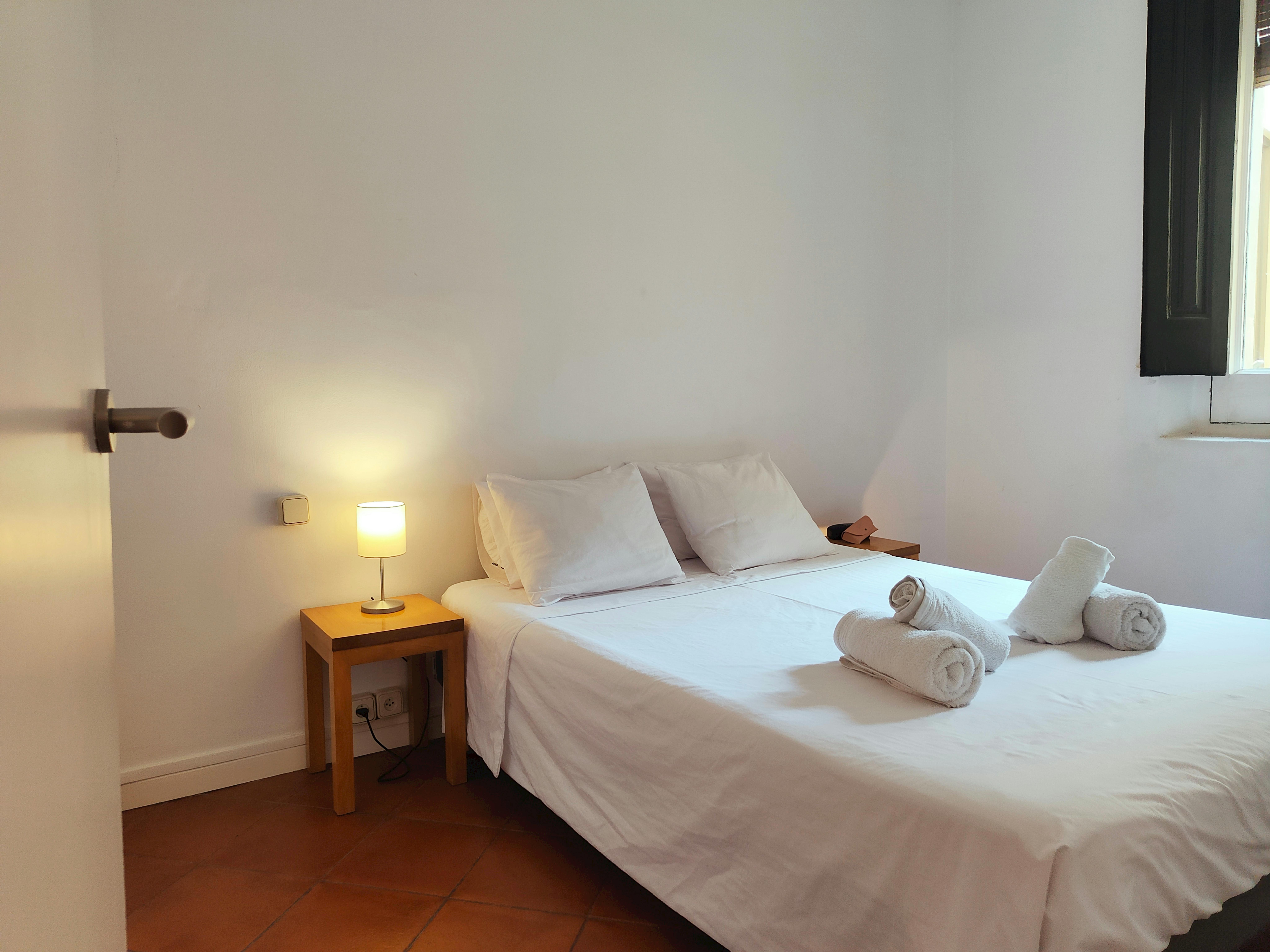 Double bedroom with heater for winter and fan for summer comfort.