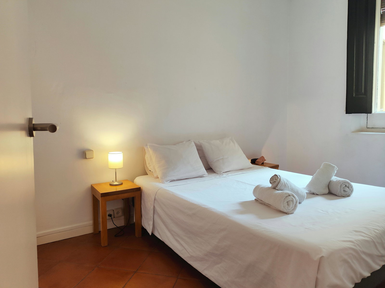 Double bedroom with heater for winter and fan for summer comfort.
