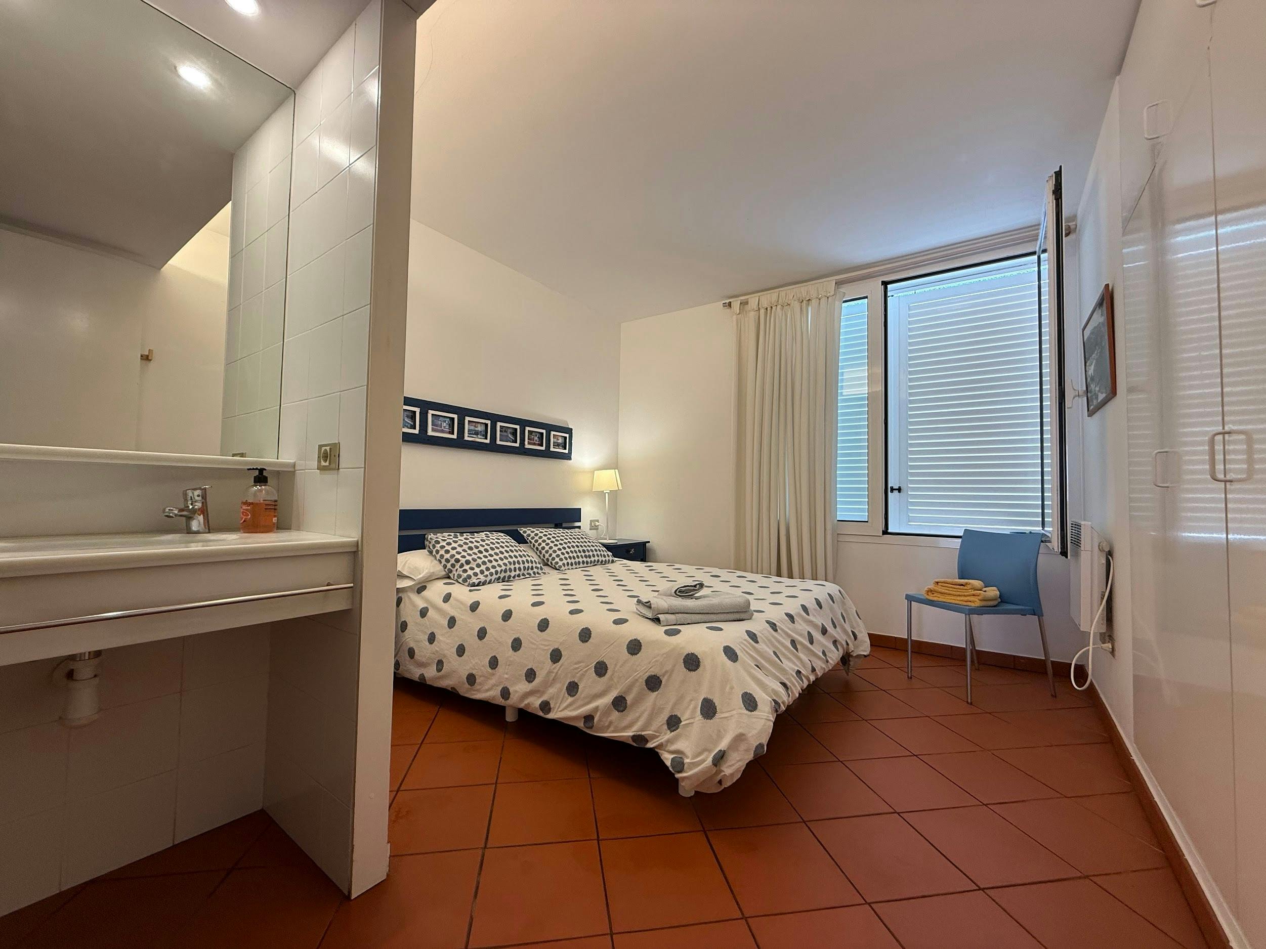 Spacious main bedroom with double bed