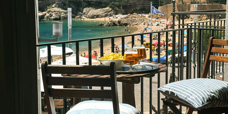 Enjoy a fresh drink while taking in the marvelous view of the beach