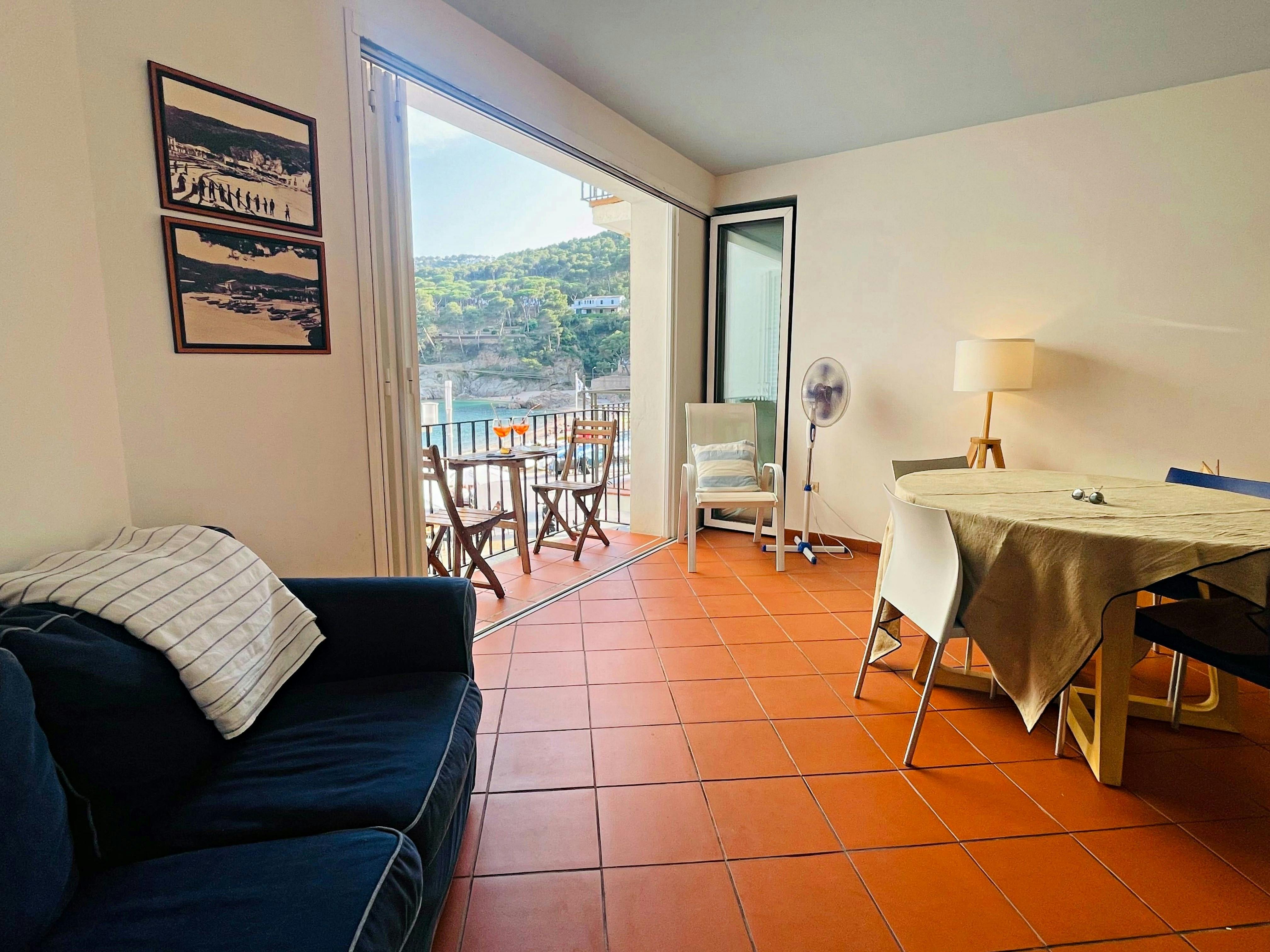 This bright and airy apartment boasts an open-plan living and dining area, creating a seamless flow between relaxation and mealtimes.