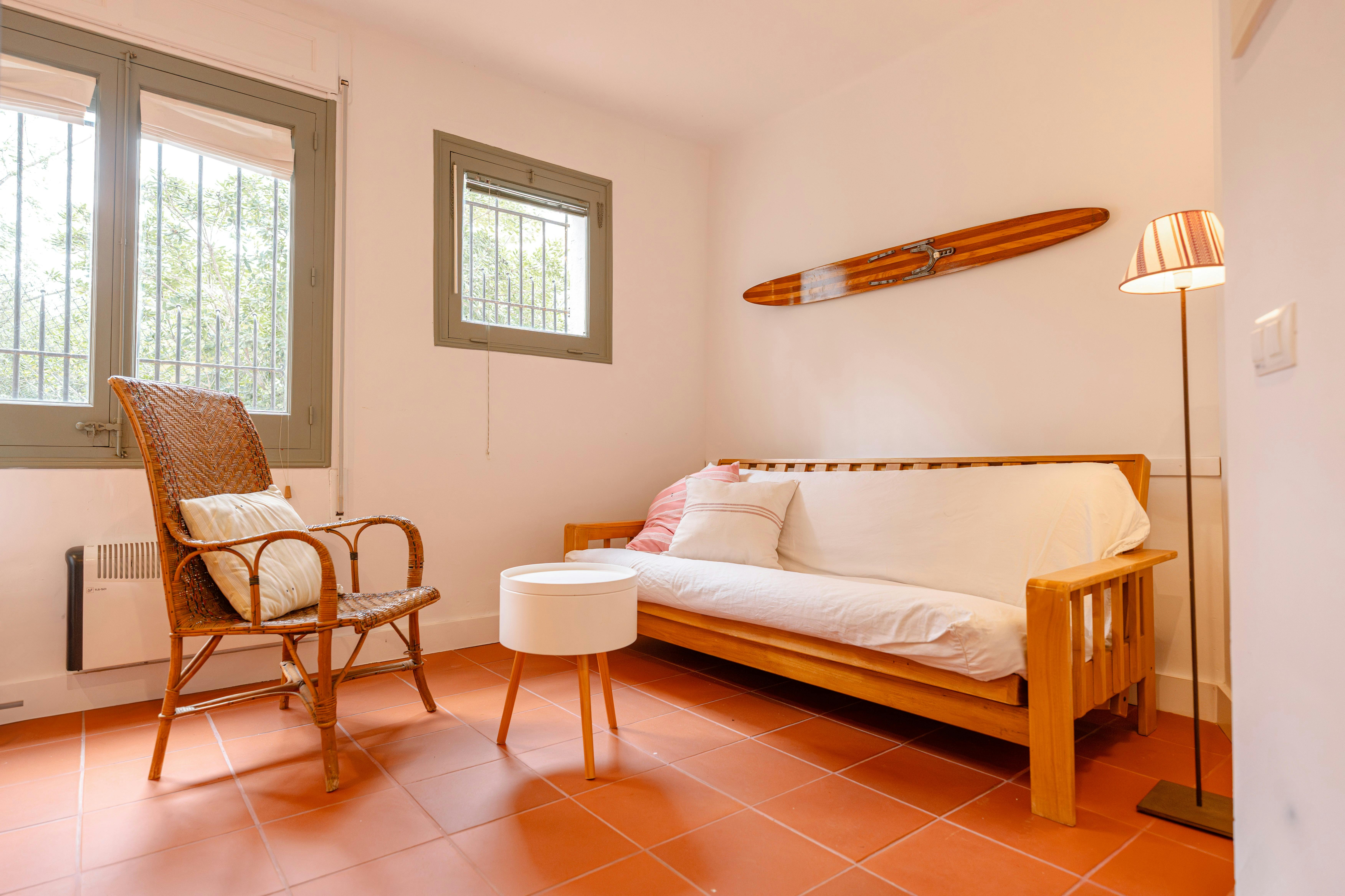 A versatile sofa bed located in a peaceful corner, ideal for unwinding