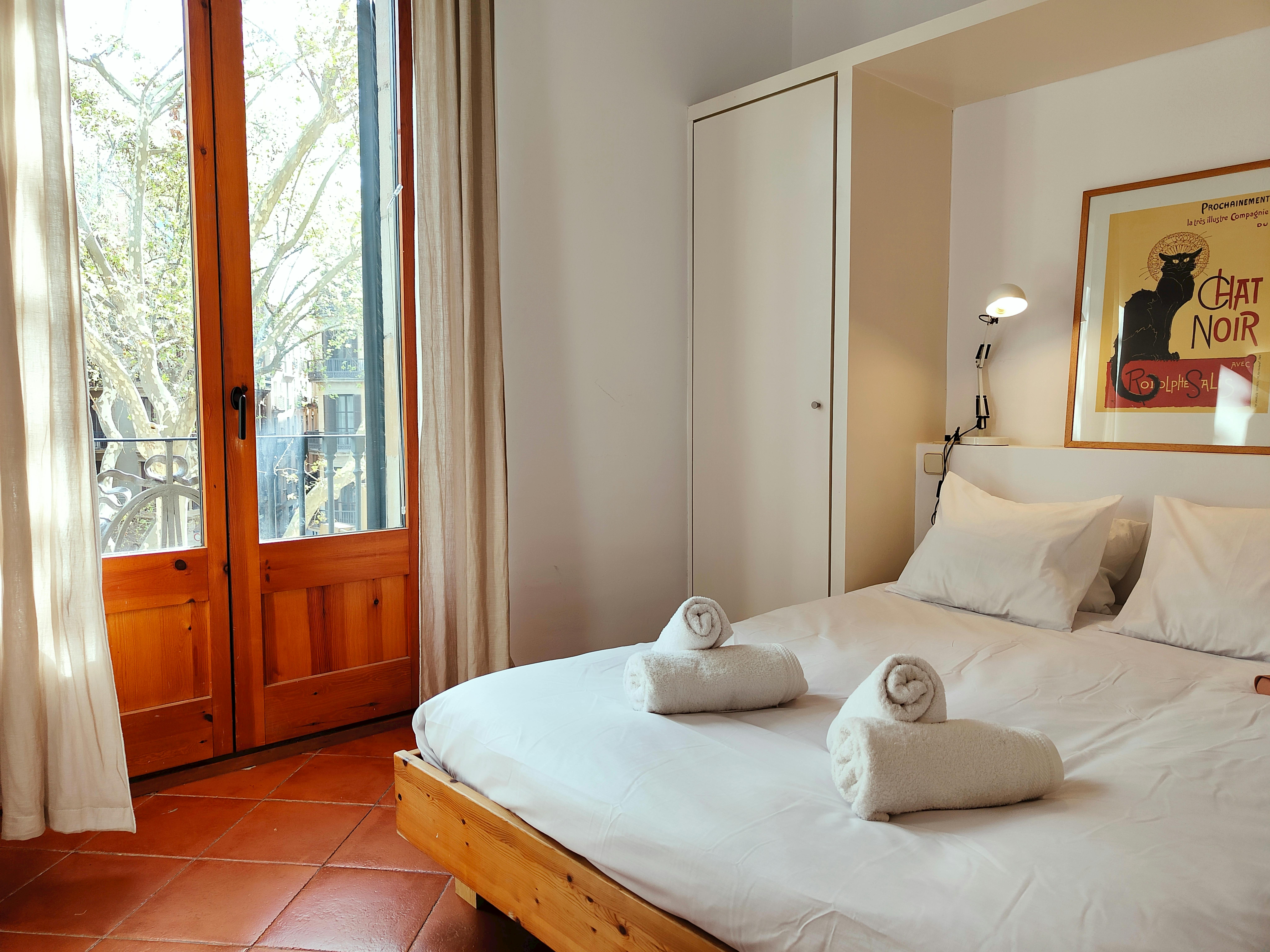 Charming French balcony overlooking vibrant La Rambla.