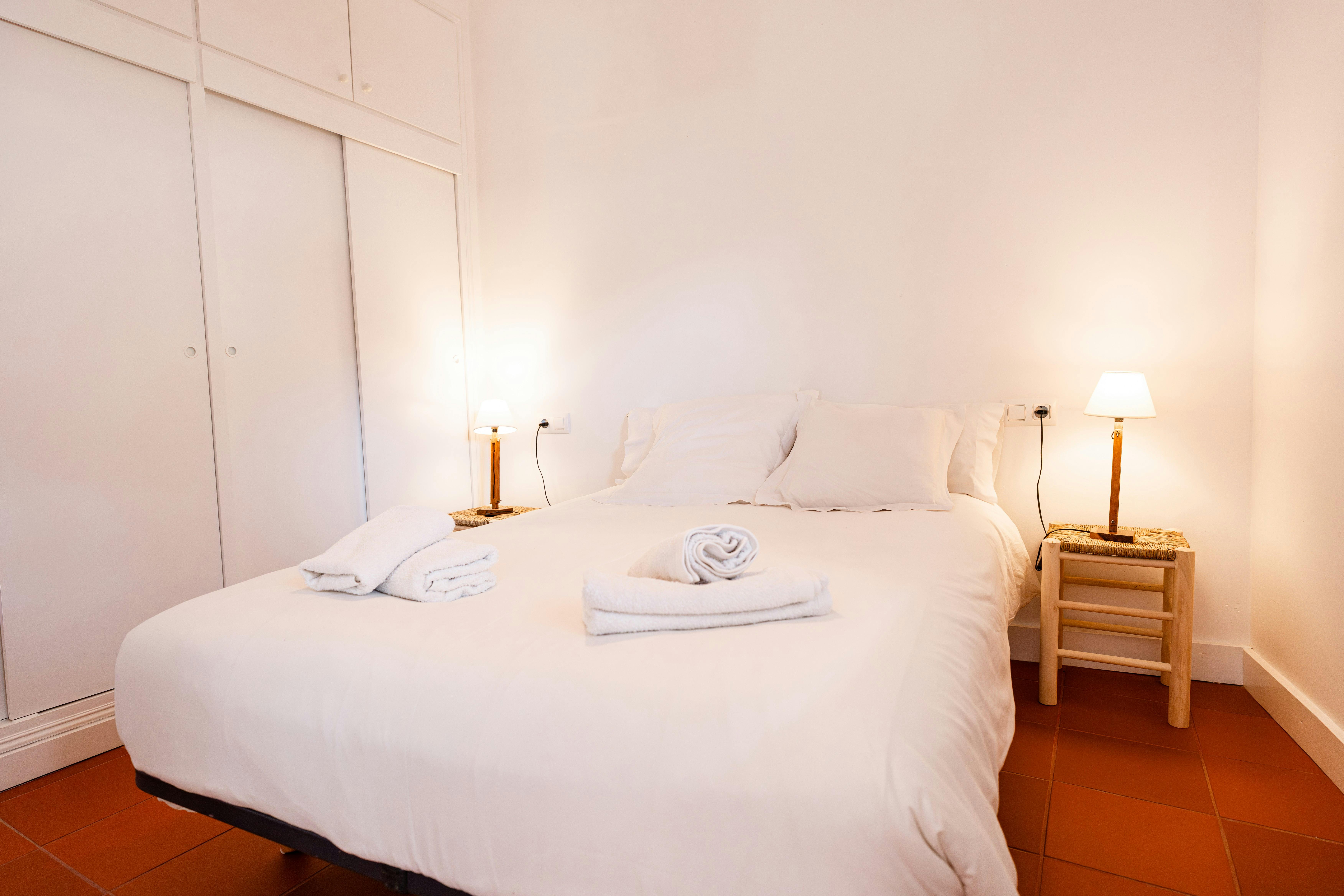 Enjoy a restful night in the double bed, complemented by a spacious wardrobe.