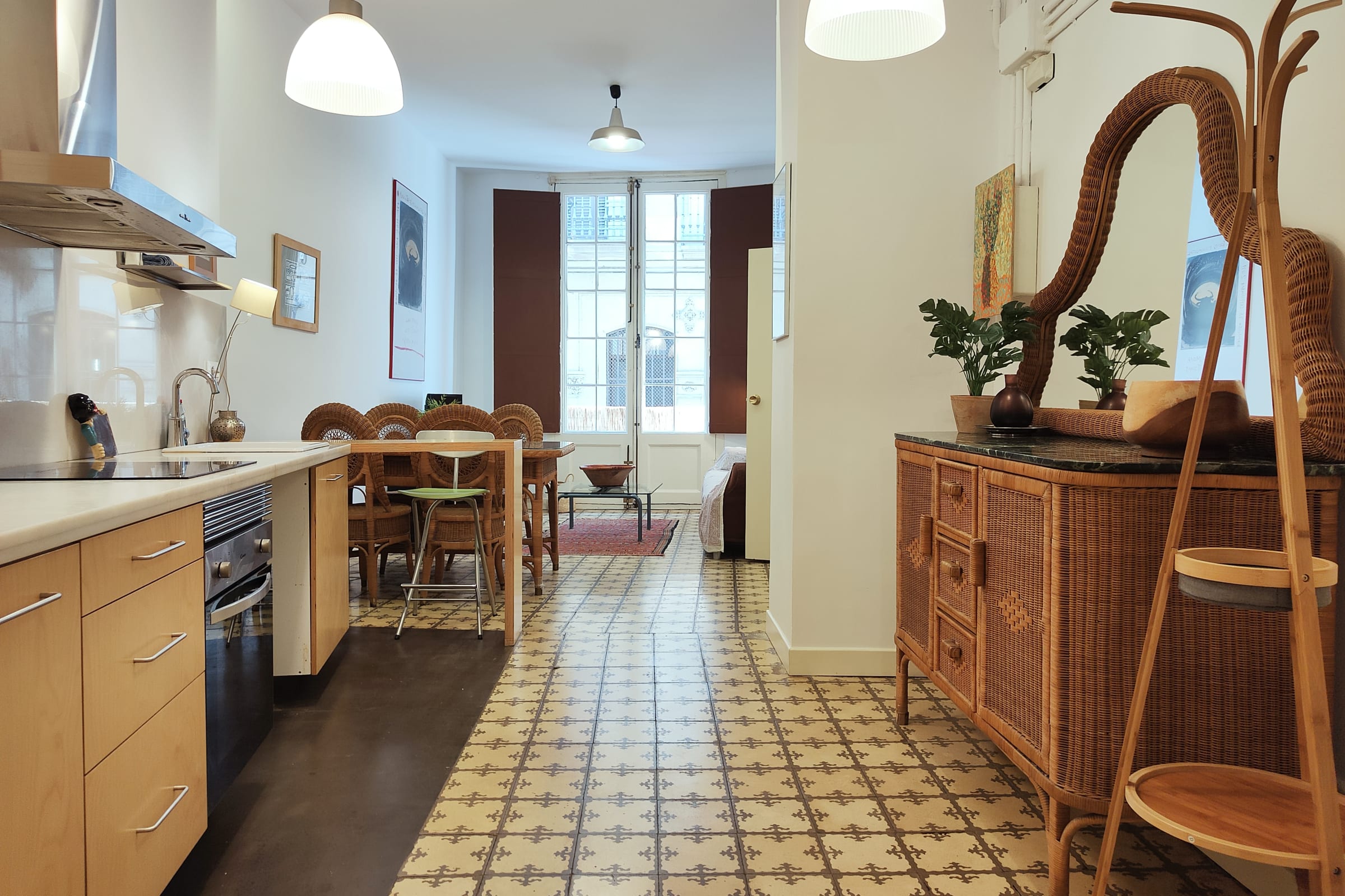 Step out onto the private balcony and enjoy the vibrant city views. The balcony features a small table and chair, perfect for enjoying a morning coffee or an evening drink. The balcony is enclosed with a bamboo screen, providing privacy and a touch of natural charm.