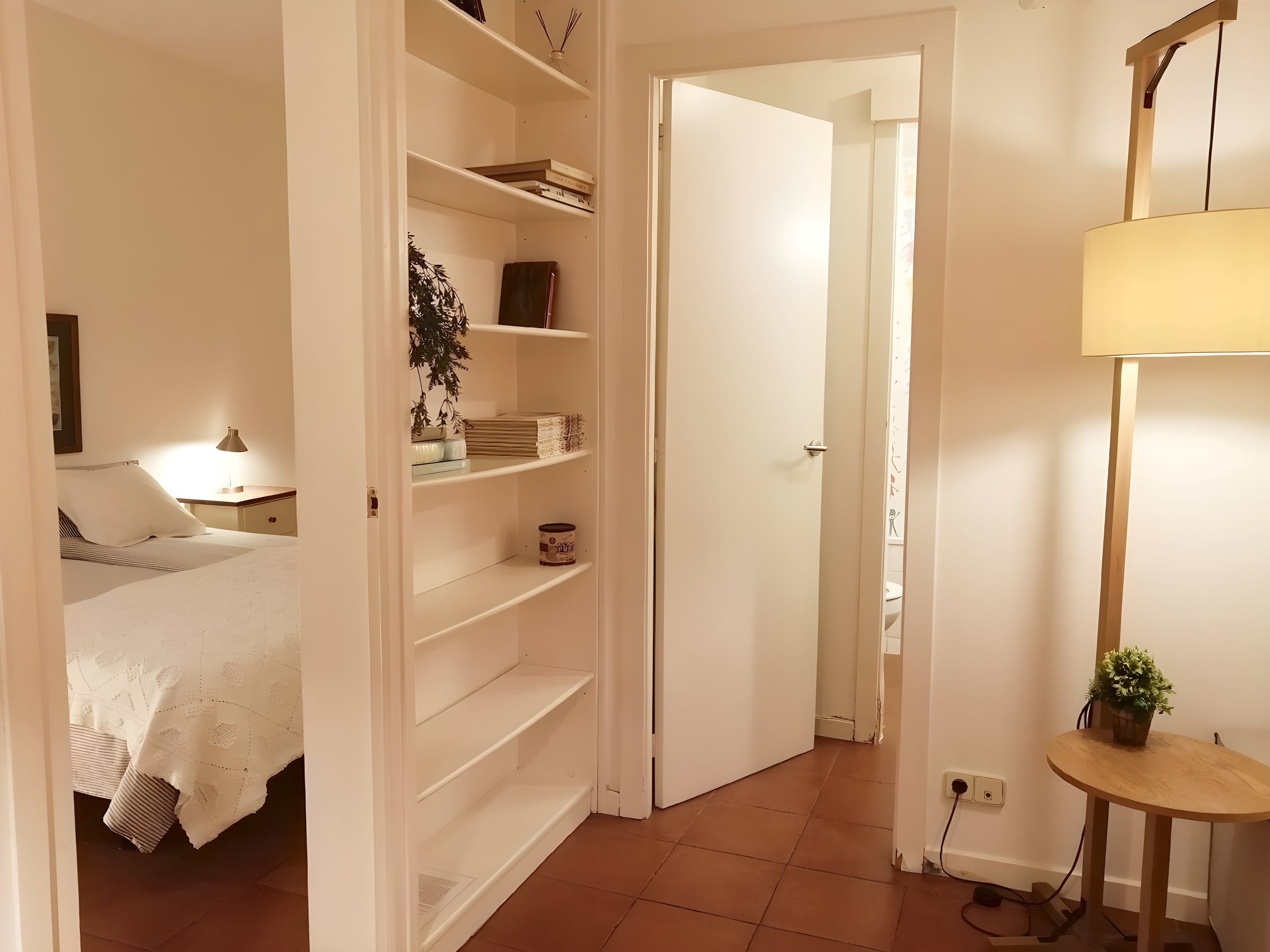 Both bedrooms are accessed from the living room; the double has a bathroom at the entrance.