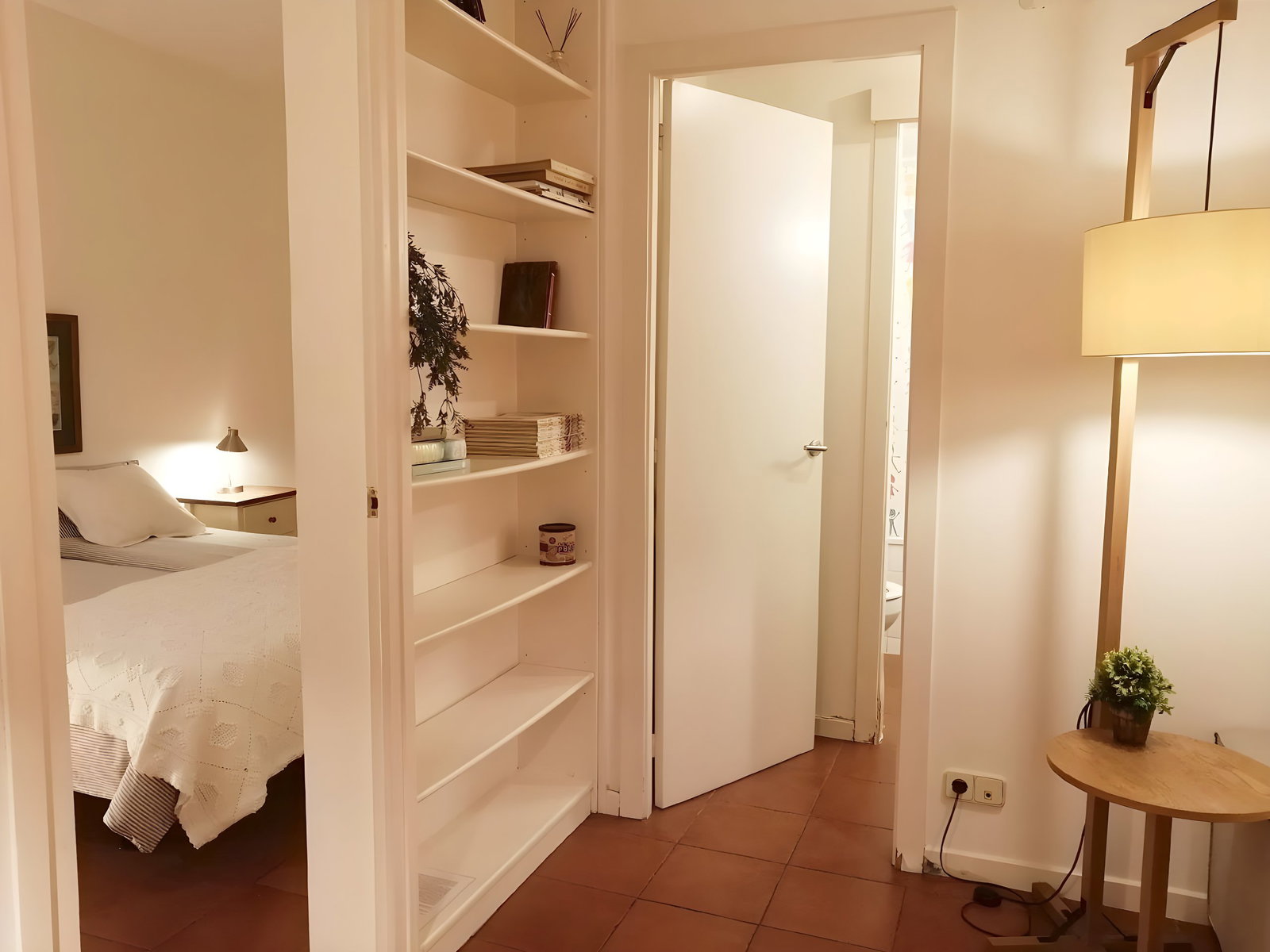 Both bedrooms are accessed from the living room; the double has a bathroom at the entrance.