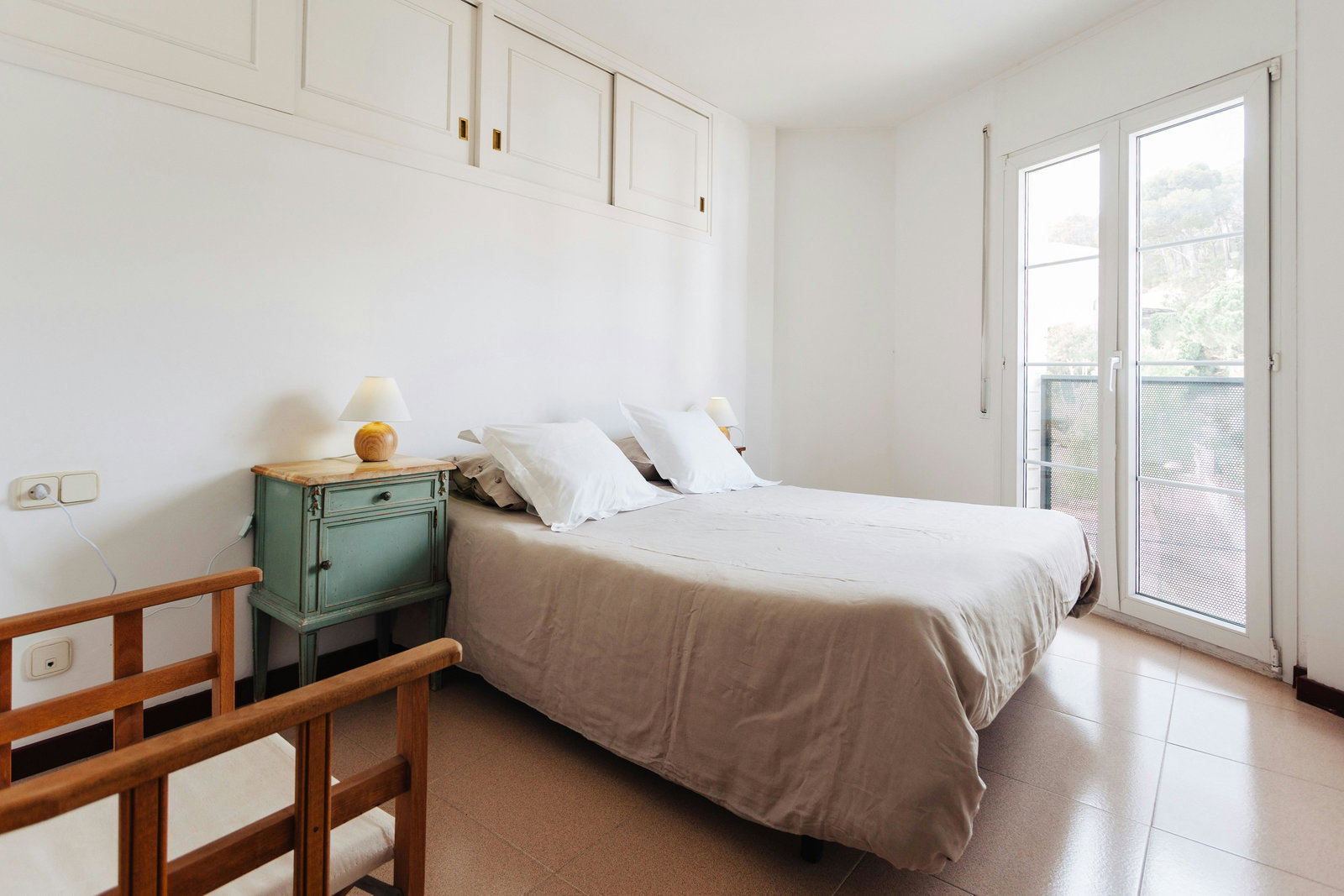Wake up to nature—this inviting bedroom offers both comfort and scenic charm.