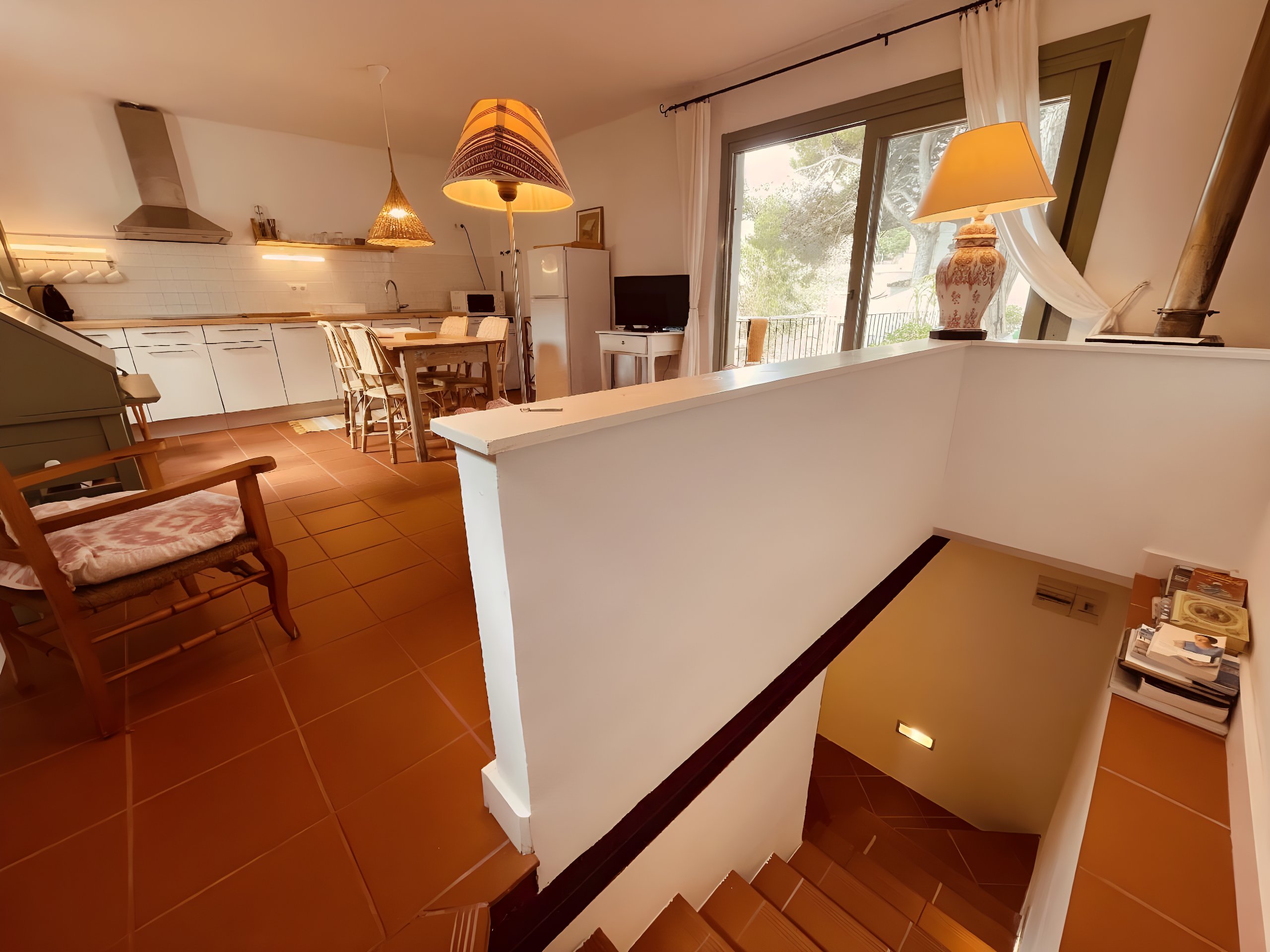 A short staircase leads you to the cozy bedroom, offering a sense of separation and tranquility.