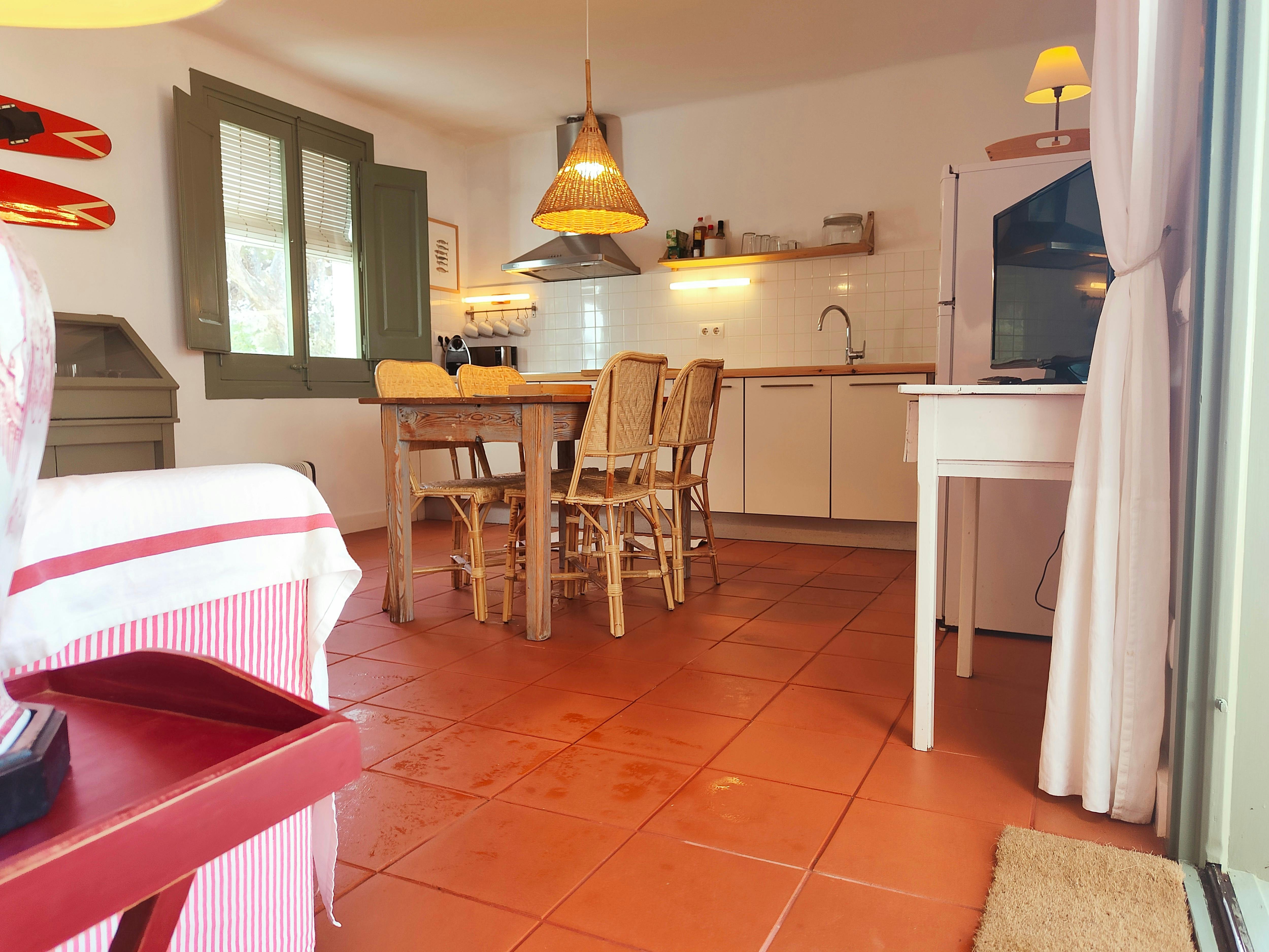 The kitchen is equipped with modern appliances, including a coffee maker, a toaster, and a microwave, ensuring you have everything you need to prepare your own meals.