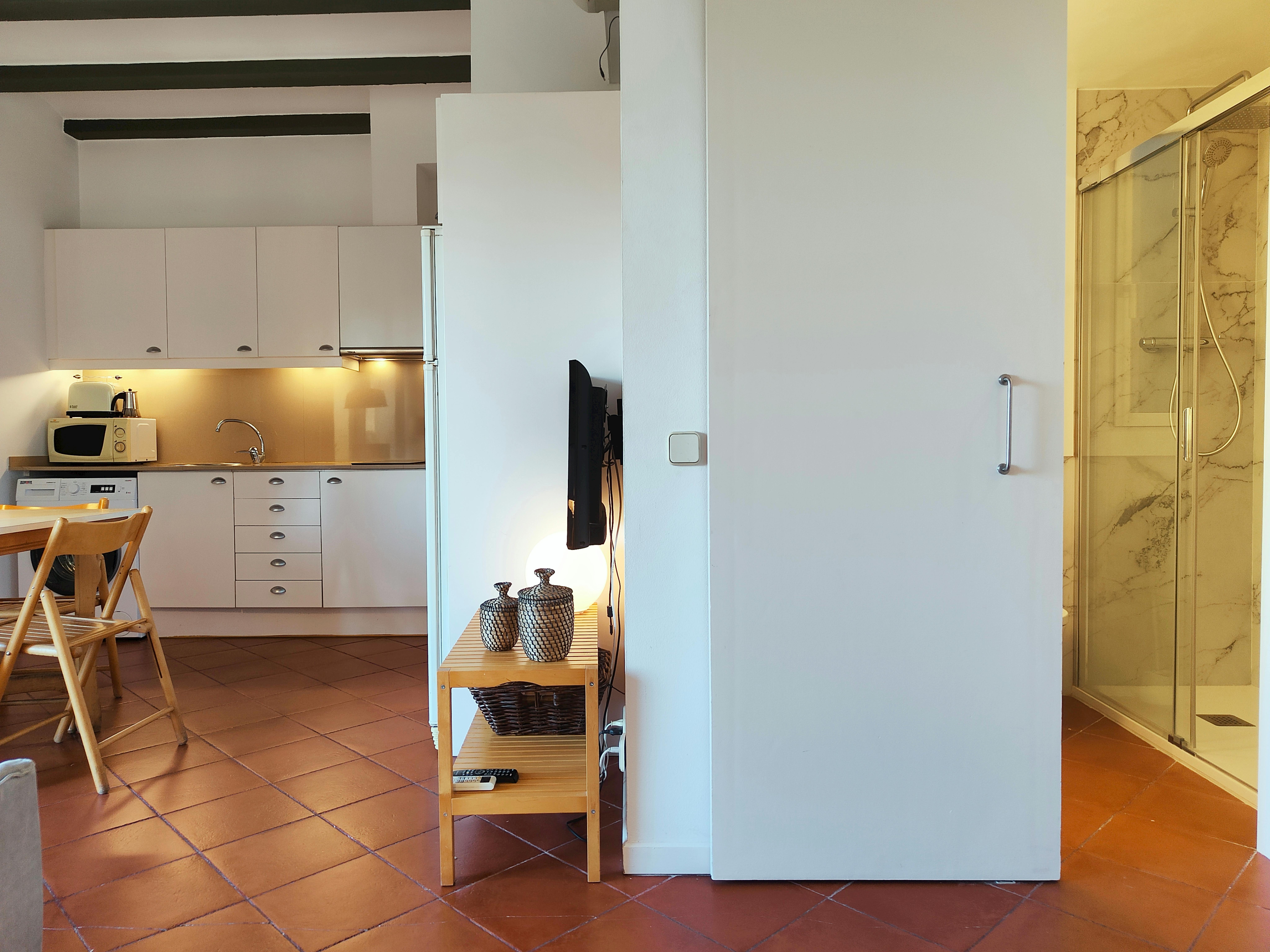 As you enter, the bathroom is immediately on your right.