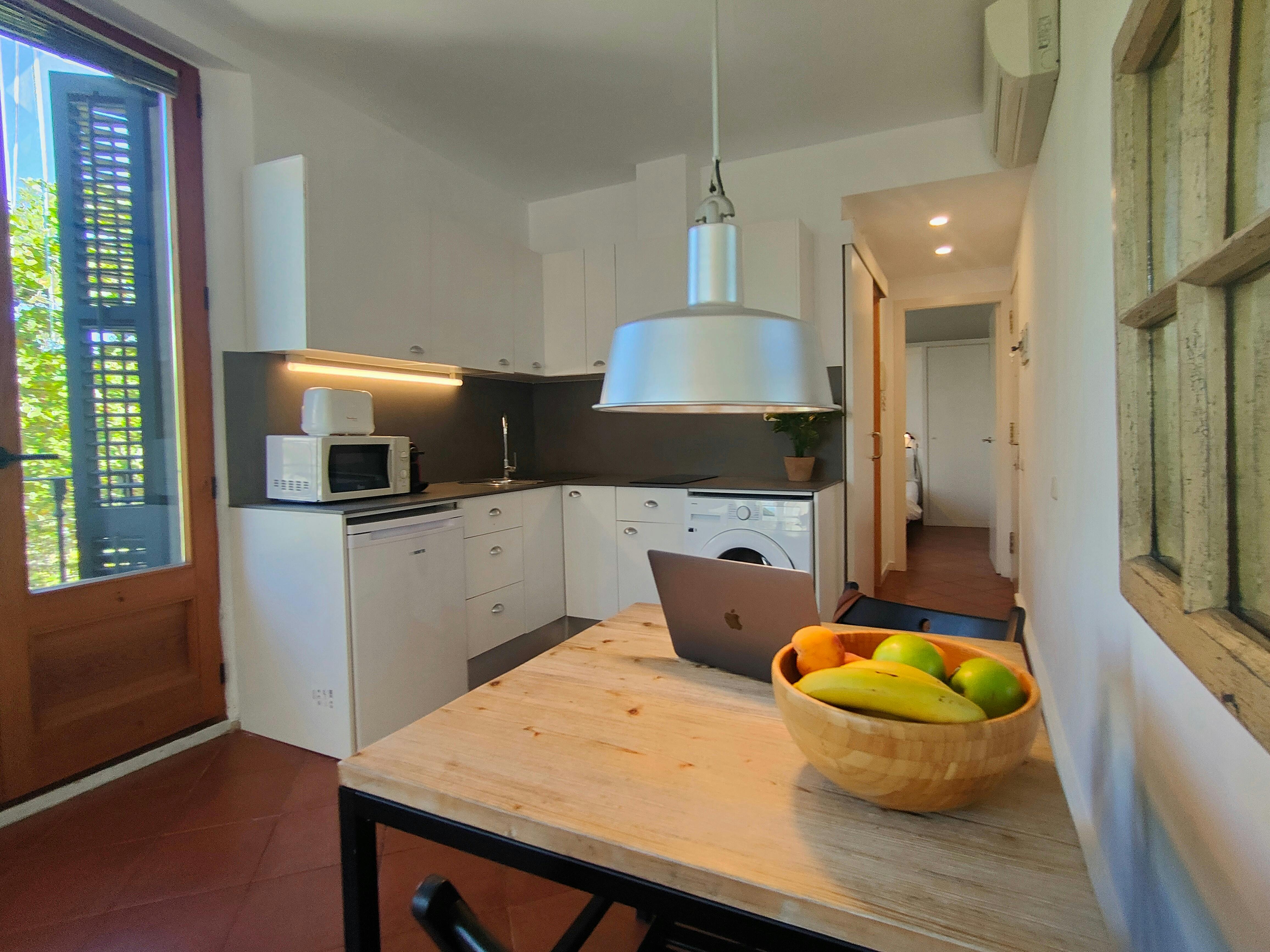 Cook like at home with a fully equipped kitchen — it even includes a washing machine for extra convenience during your stay.