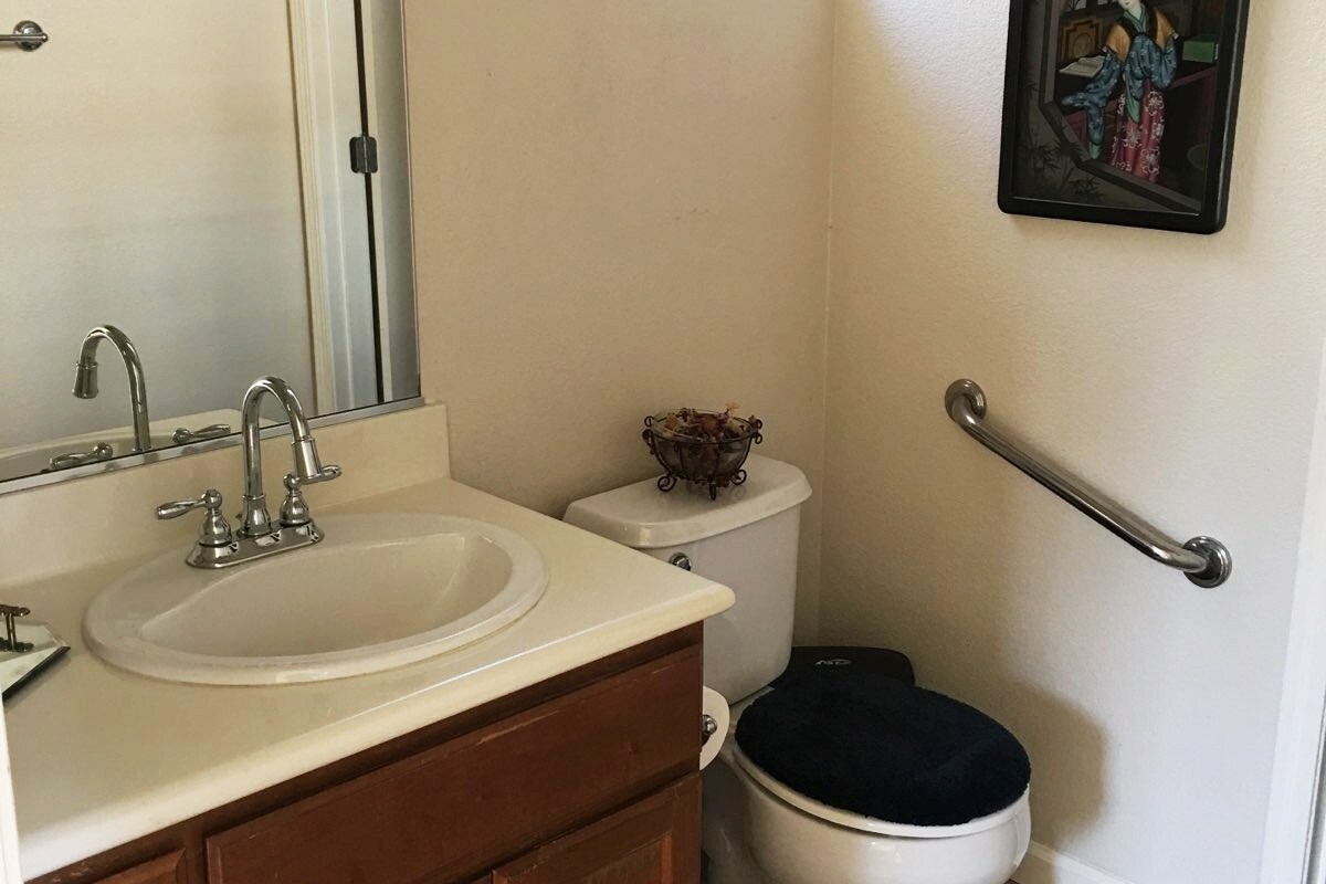 Oversized bathroom with gooseneck faucet in the bathroom sink (on a swivel for easy clean up of dishes).  Vanity has plenty of storage for long term guests.  Walk, double shower is past the sink and toilet.  Plenty of space to share for 2 guests.