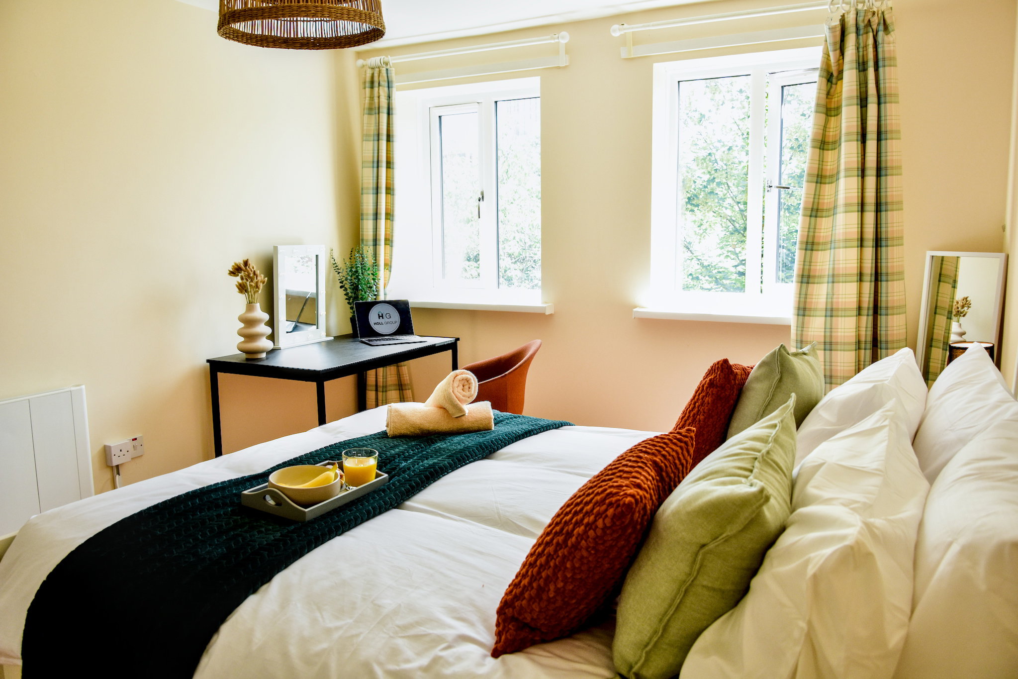 Enjoy abundant natural light or sleep in with blackout curtains. Rest easy on a king-size memory foam mattress. The illuminated makeup station with lights and premium chair double perfectly as a comfortable remote workspace for your relaxing stay.
