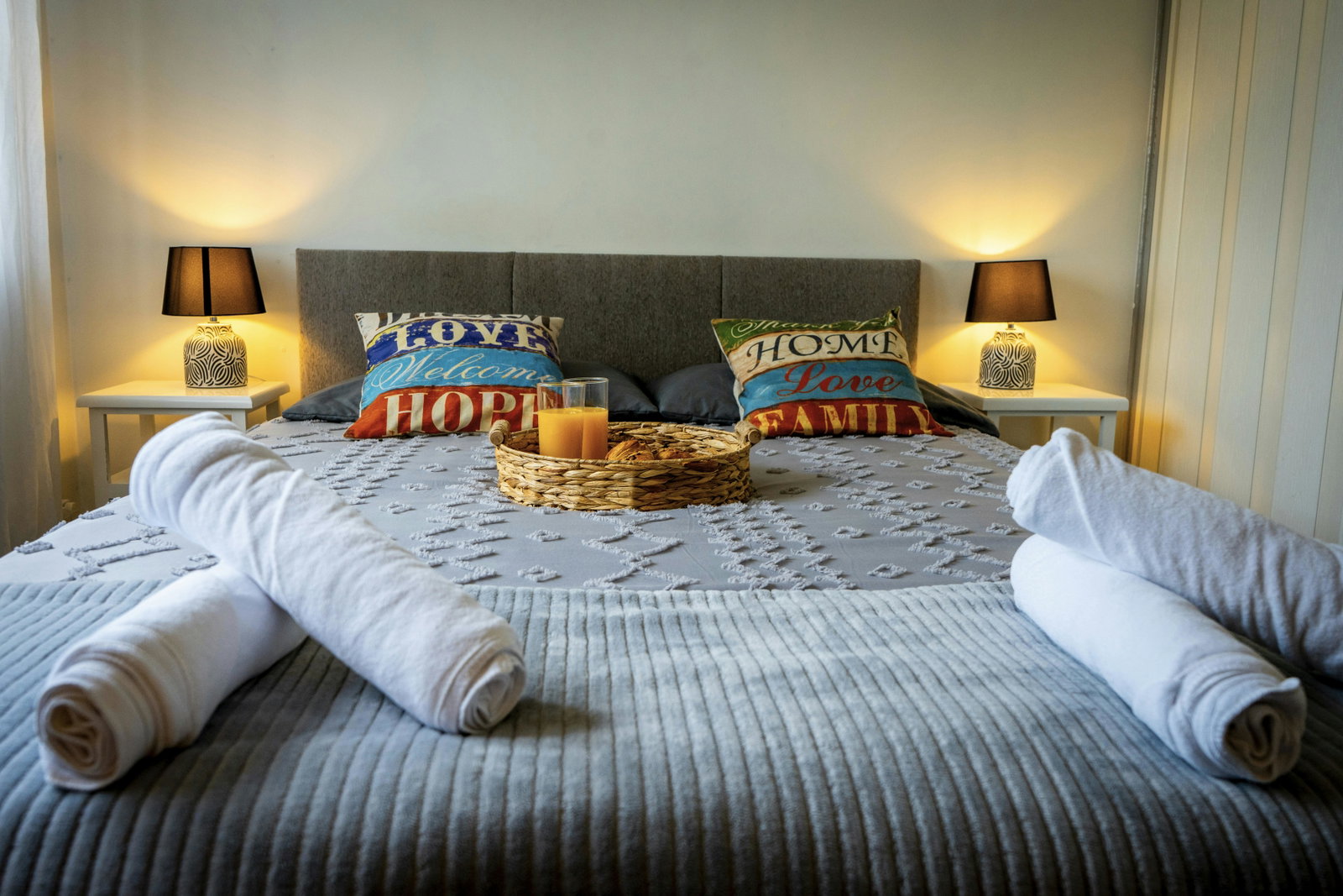 Spacious and bright master bedroom featuring a Super King Size bed with convenient bedside sockets. Fully equipped with a Smart TV, central heating, a large wardrobe, and a single sofa bed. A baby cot is also available upon request