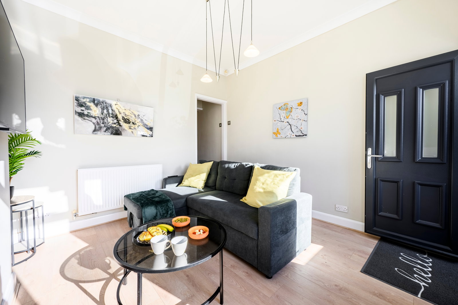 The front door opens into the lounge through a small porch with two locking doors, adding extra security.