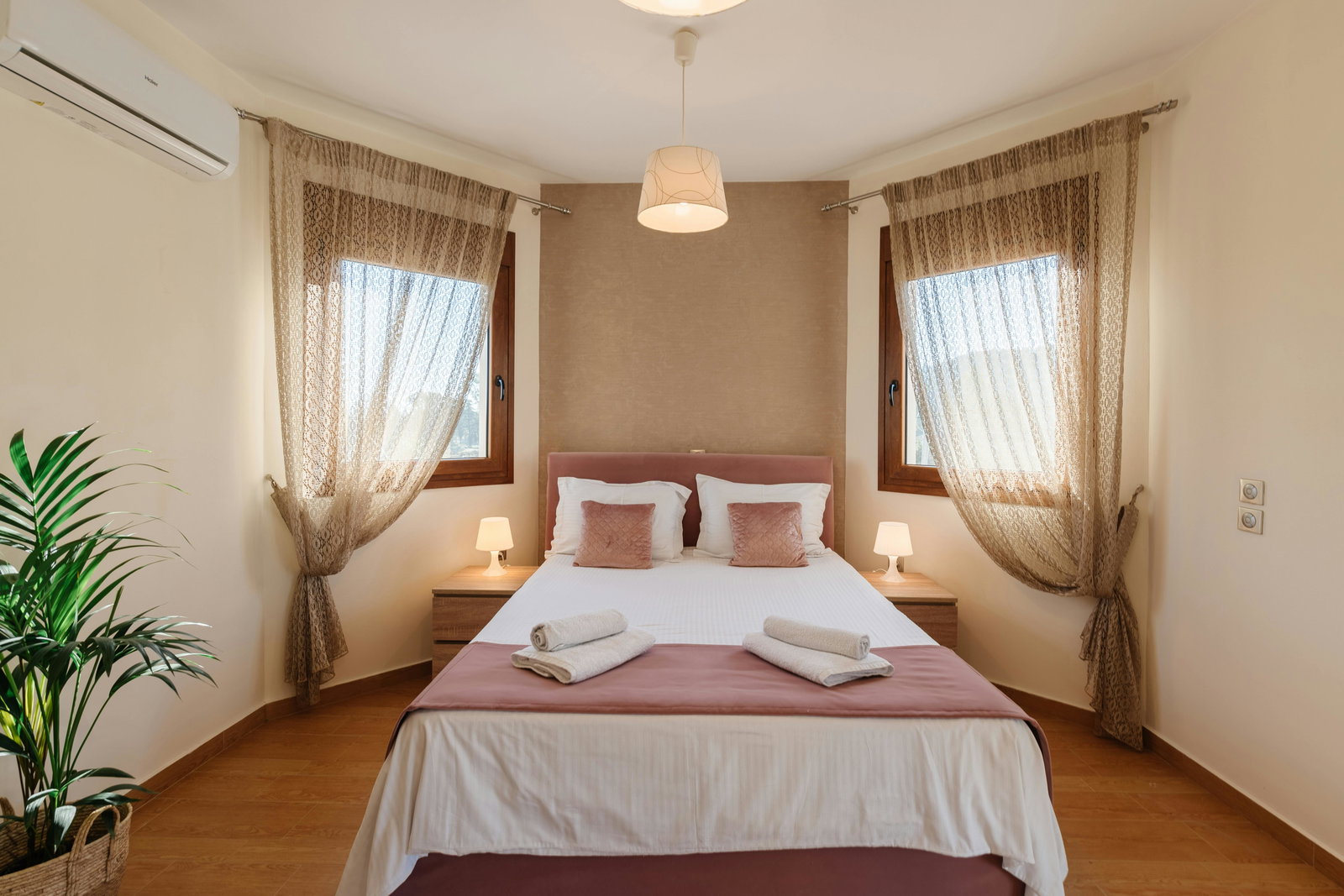 Master Bedroom Comfort: A cozy queen-size bed in the elegant master bedroom with soft natural light.