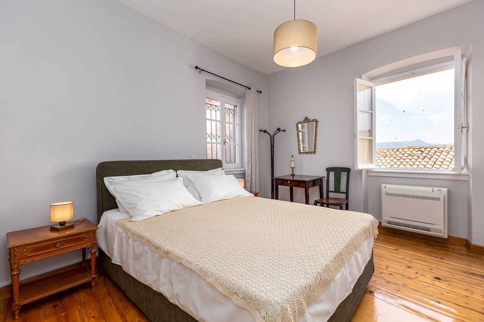 Master bedroom with comfortable Queen size bed. The room is equipped with individual A/C, desk and hangers. The view from the window is memorable!