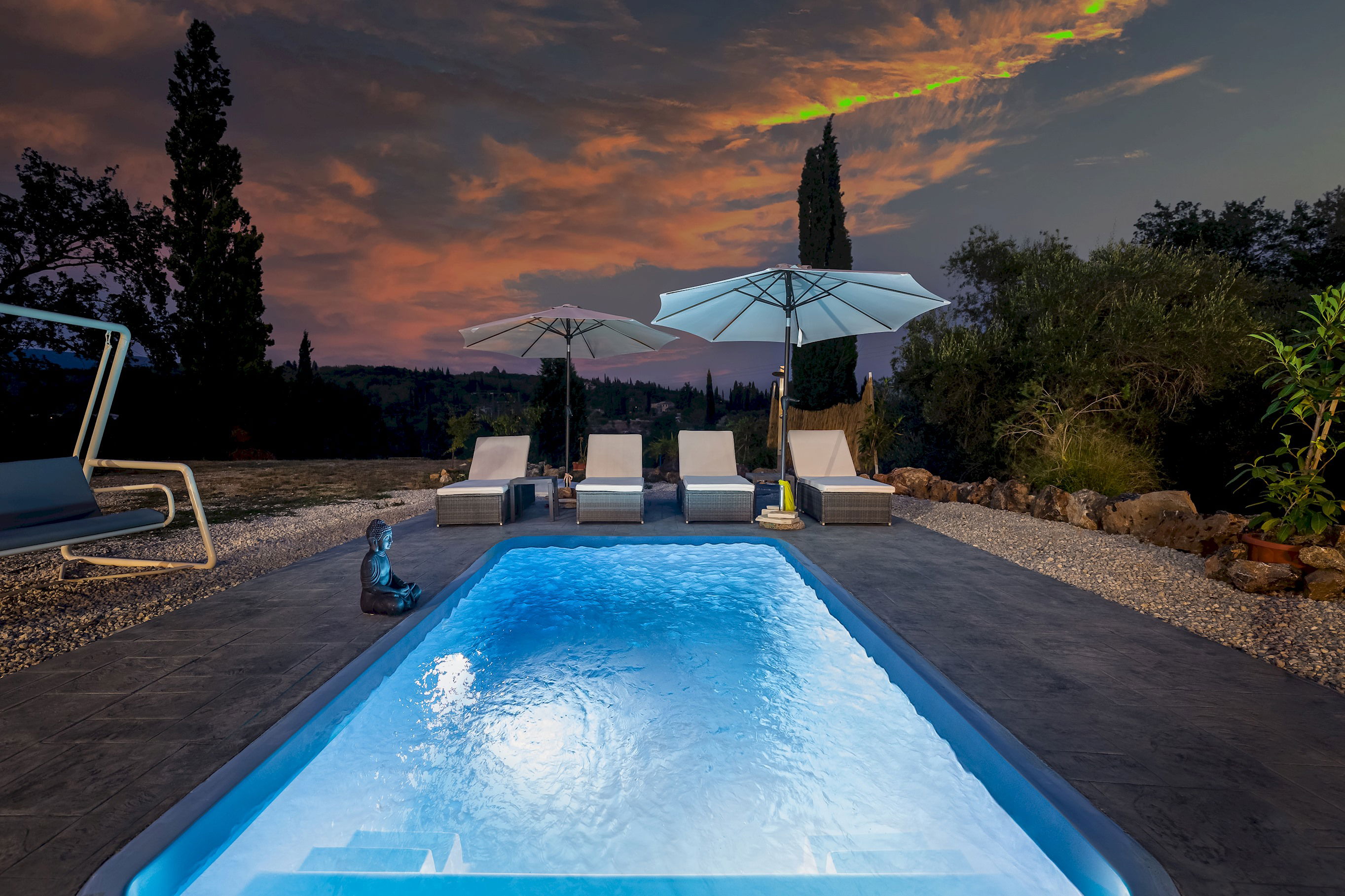 "Experience the serenity of a night swim in the midst of lush greenery - your own private oasis awaits at our suites"