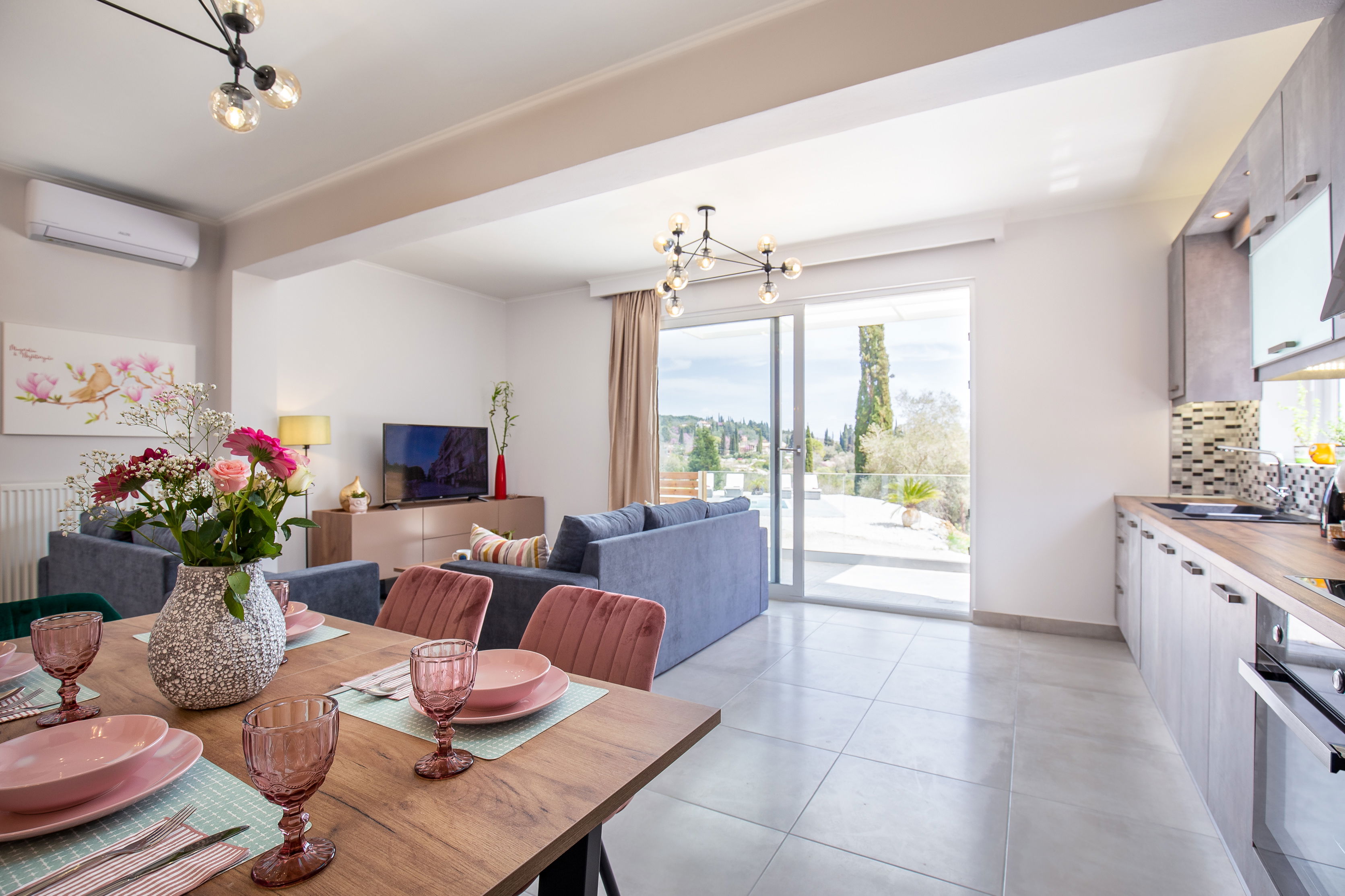 "Relax and unwind in style with a stunning view of the pool from your modern and fully-equipped kitchen. Your dream vacation starts here at our luxurious suites."