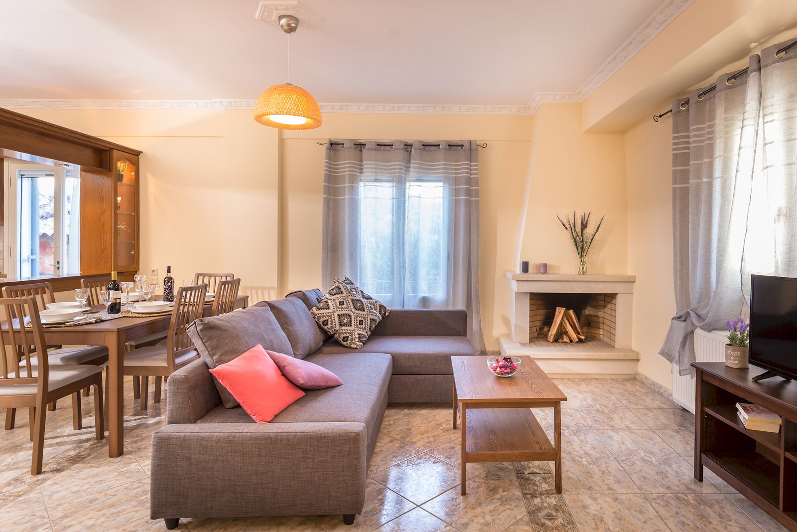 Cozy family room with fireplace. Open concept living space including kitchen, breakfast area, dining room, and family room.