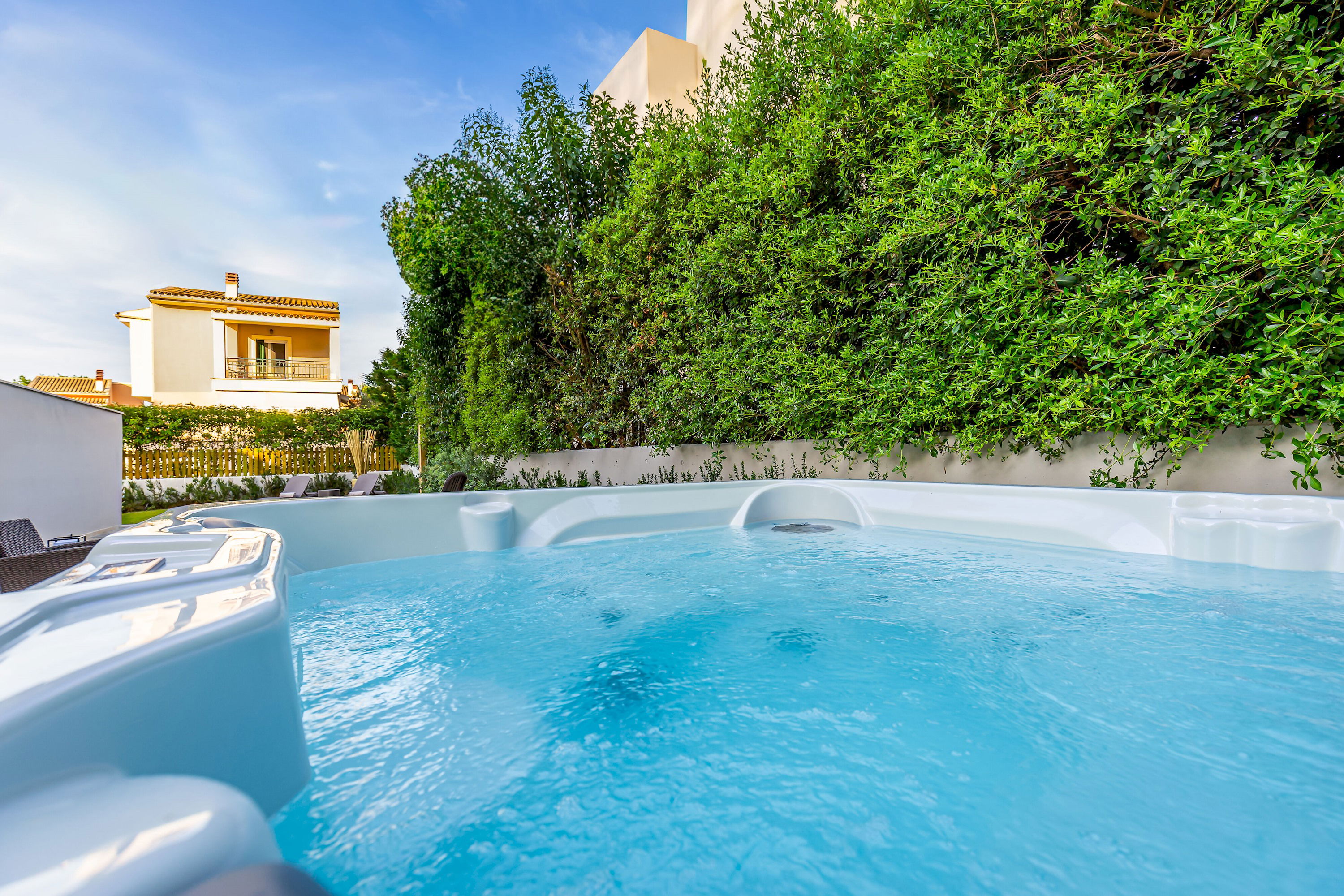 "Escape to our outdoor oasis and melt away stress in our heated jacuzzi, the perfect spot for a rejuvenating soak under the open sky."