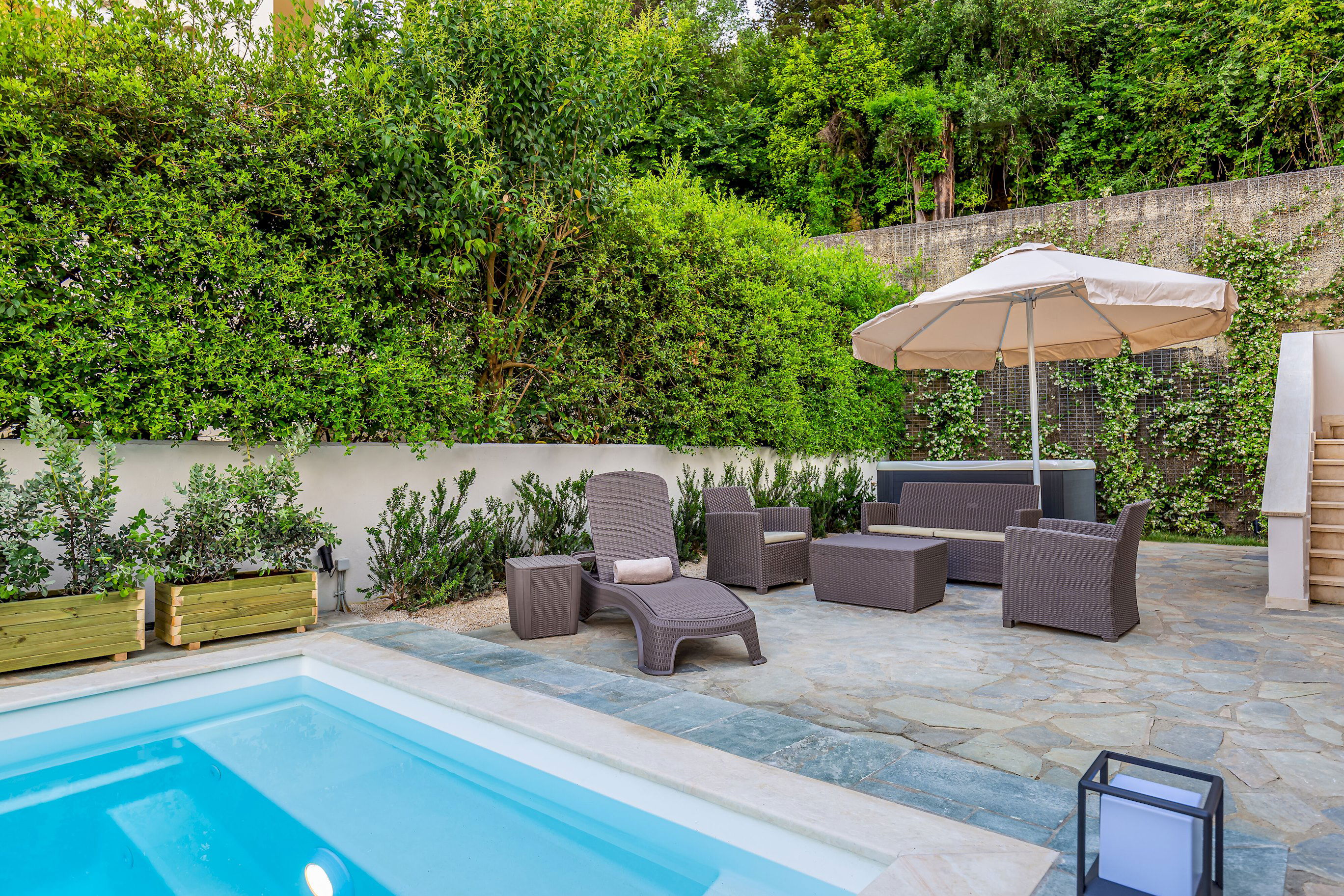 "Unwind in style on our luxurious sunbeds, where comfort meets tranquility in the heart of our peaceful garden retreat."