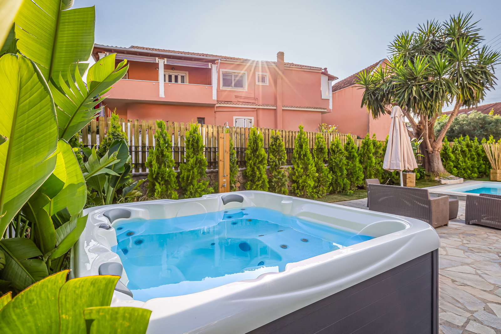"Escape to our outdoor oasis and melt away stress in our heated jacuzzi, the perfect spot for a rejuvenating soak under the open sky."