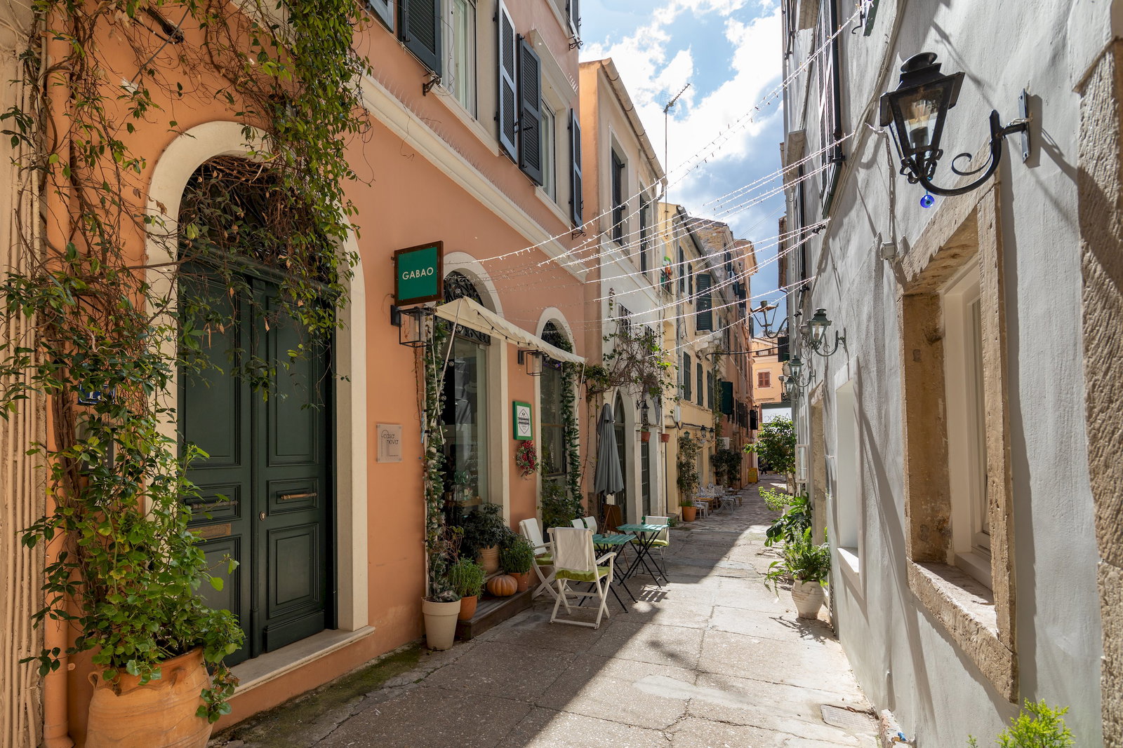 "Immerse yourself in the vibrant atmosphere of our neighborhood, lined with quaint shops and inviting cafes."