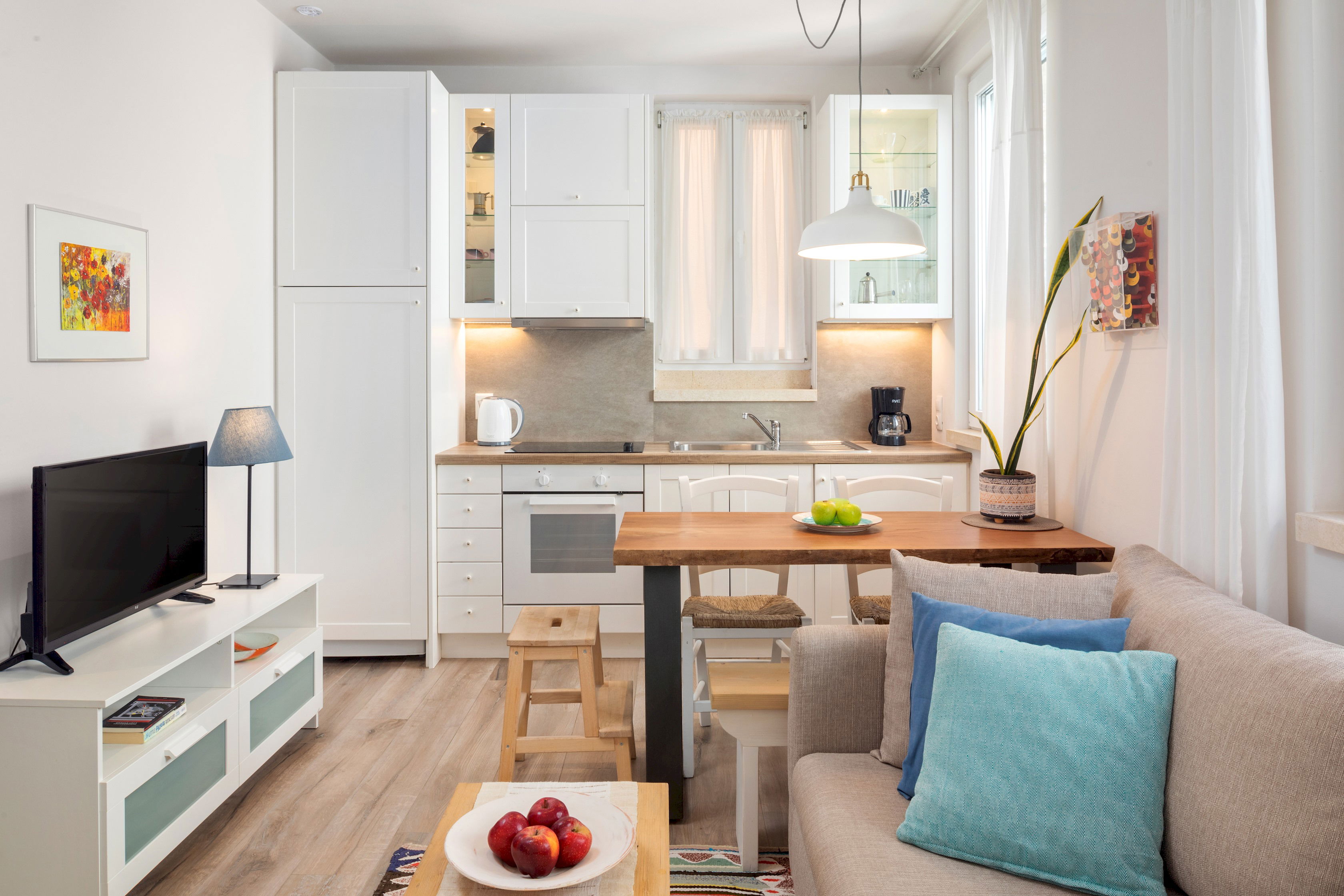 "Experience the essence of Greek hospitality in our thoughtfully designed studio."