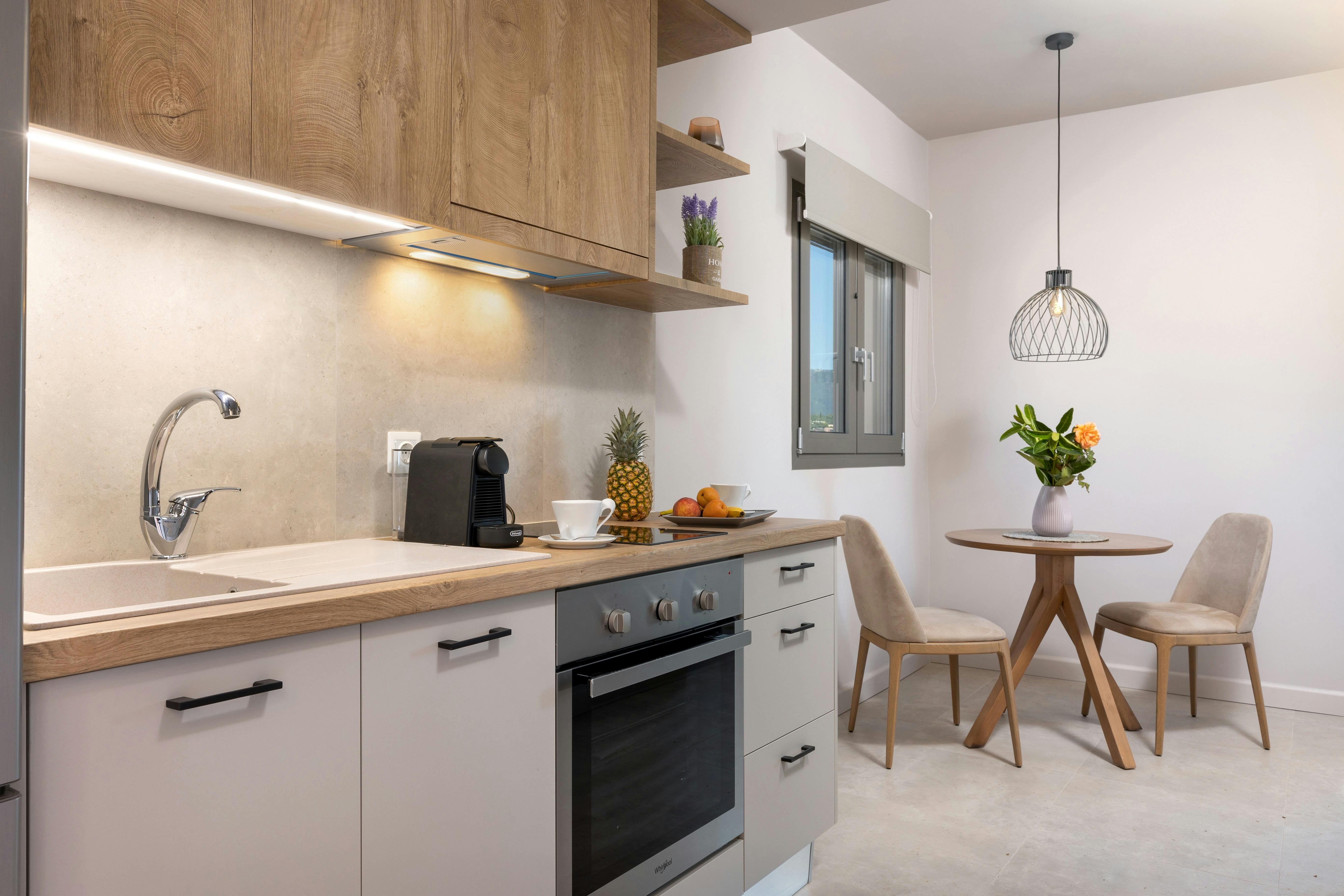 "Designed for your convenience – prepare meals or enjoy a quiet breakfast in this stylishly functional kitchen."