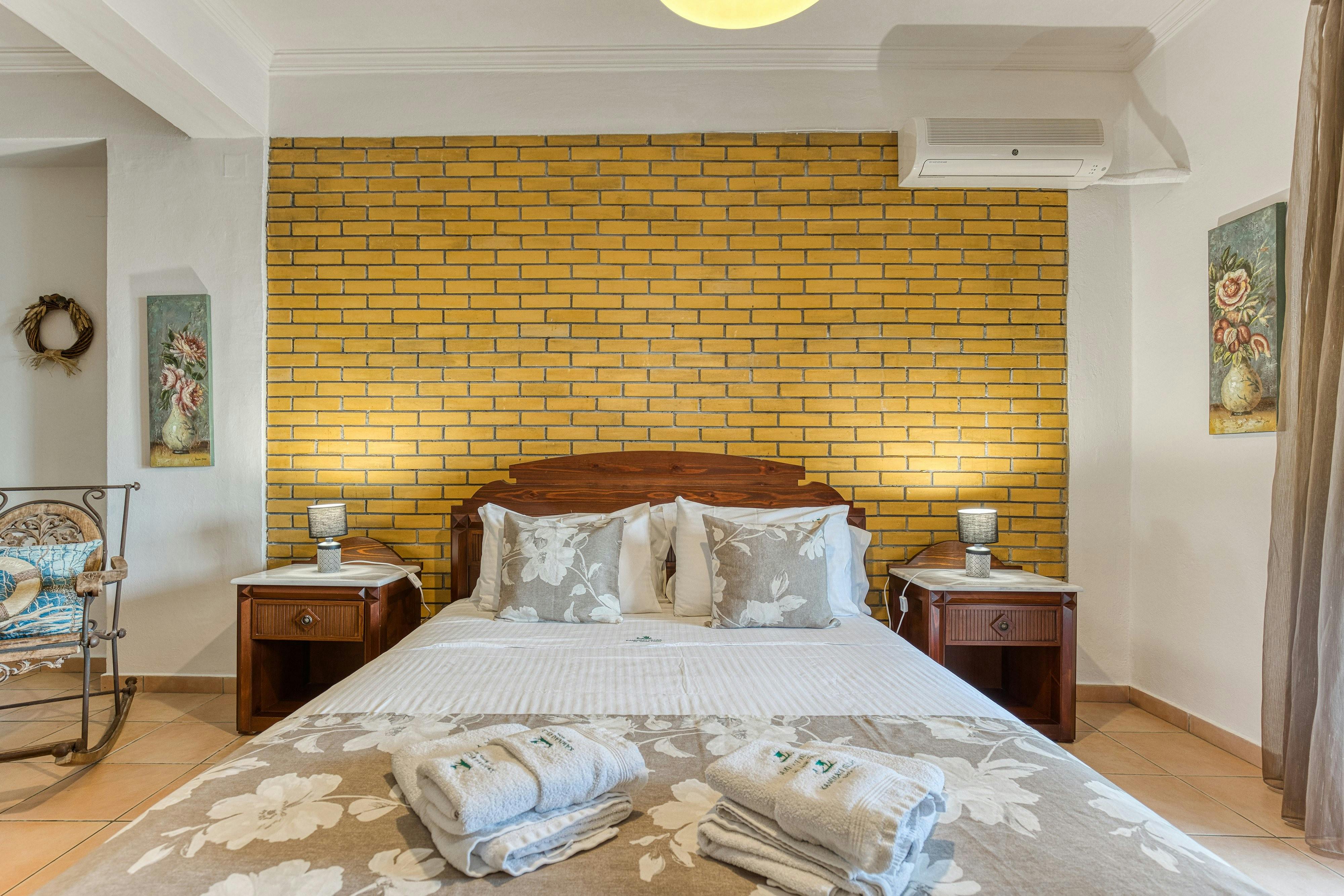 Cozy Bedroom: The warm and inviting design of the first-floor bedroom, perfect for a restful night.