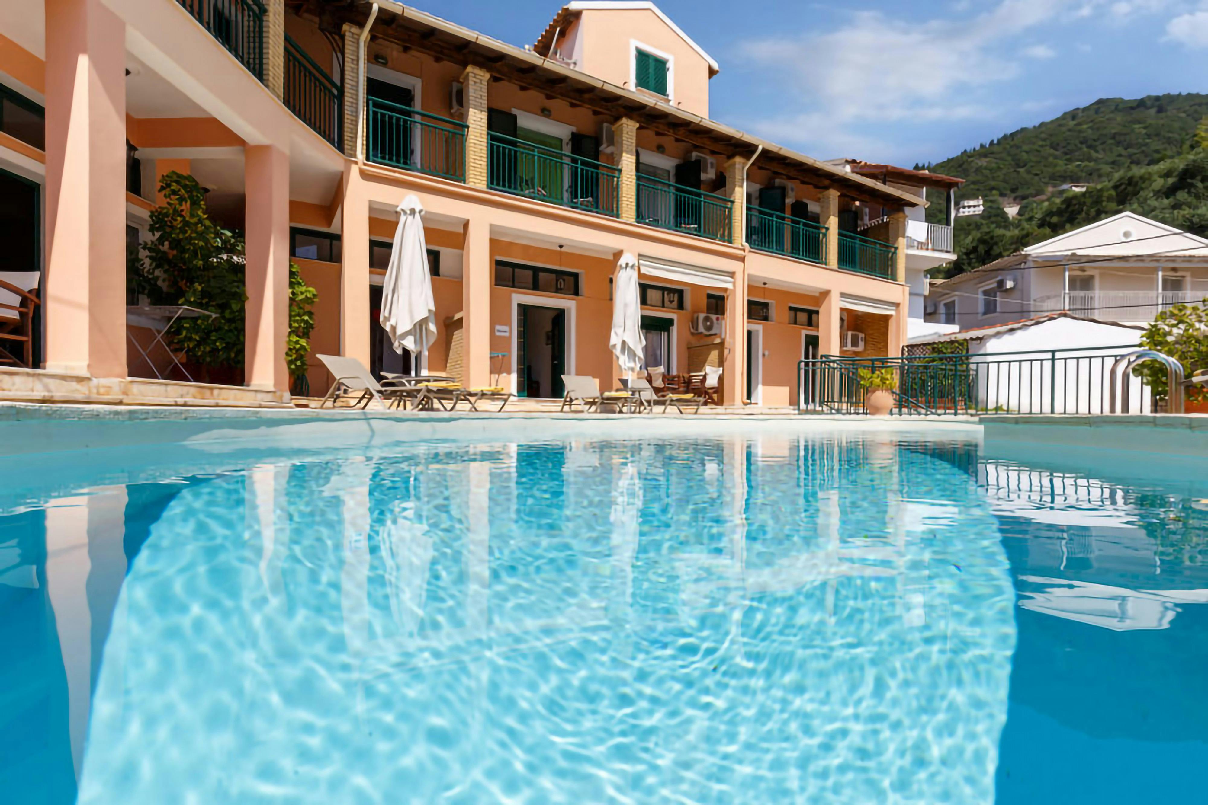 The Sparkling Pool: Enjoy a refreshing swim in the shared pool, complete with sunbeds and umbrellas for ultimate relaxation.