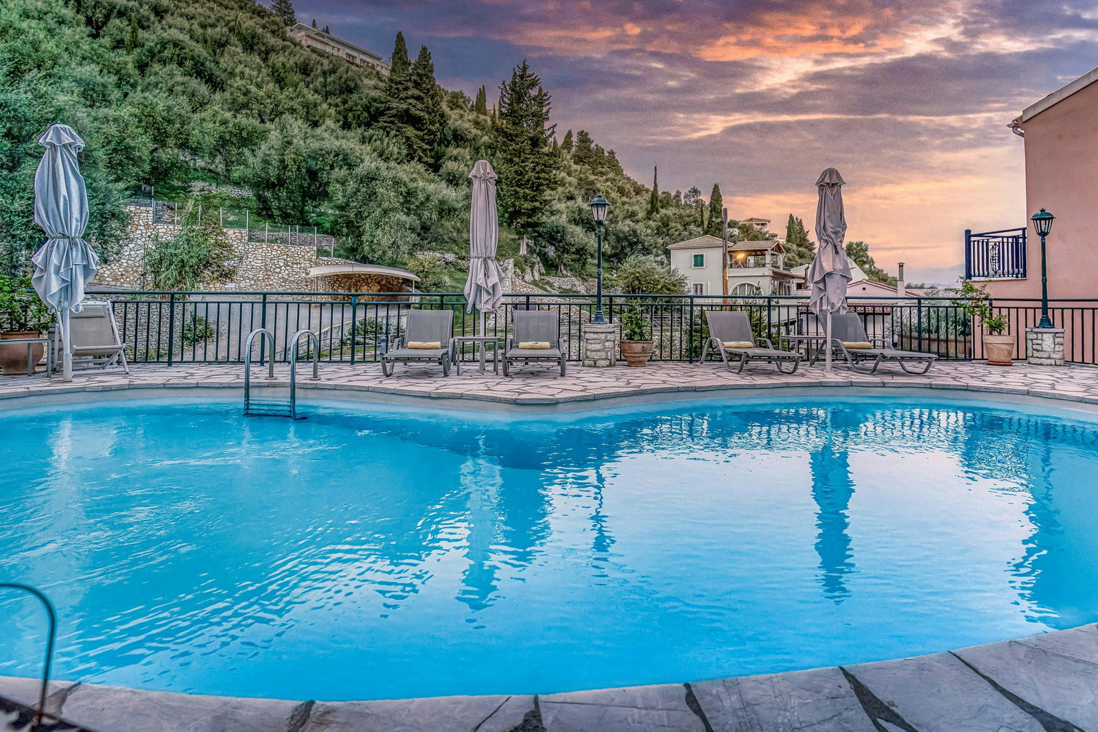 Poolside Serenity: Lounge by the pool while soaking in the peaceful ambiance of Kaminaki Village.