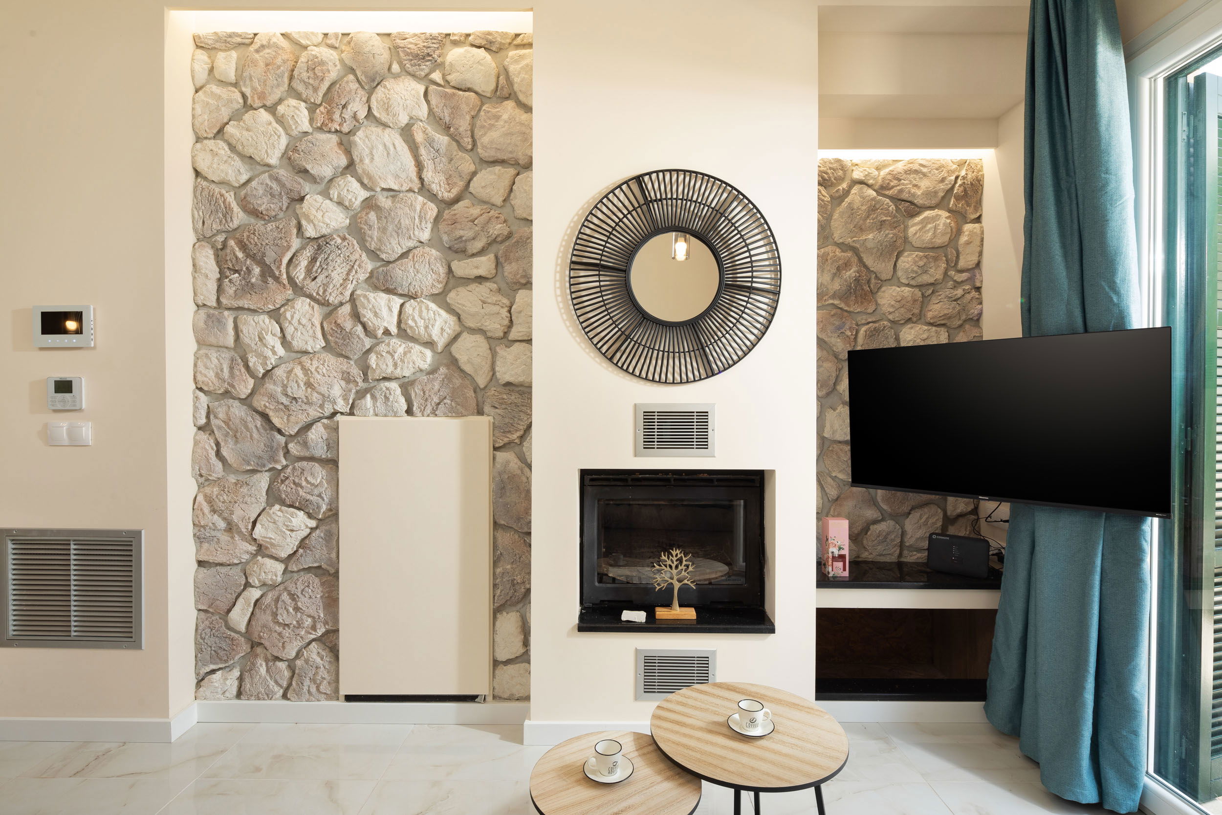 "Our living room's L-shaped sofa and the fireplace create the perfect ambiance for your stay."