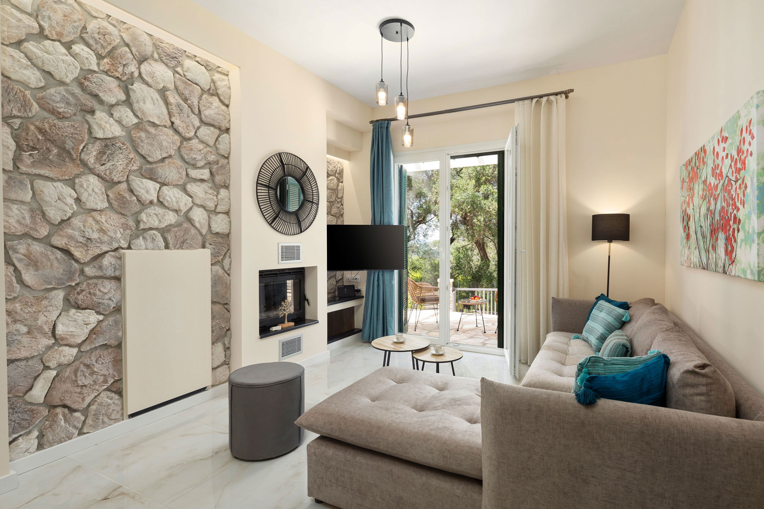 "Cozy up by the fireplace in our stylish living room with an L-shaped sofa, perfect for relaxing evenings."