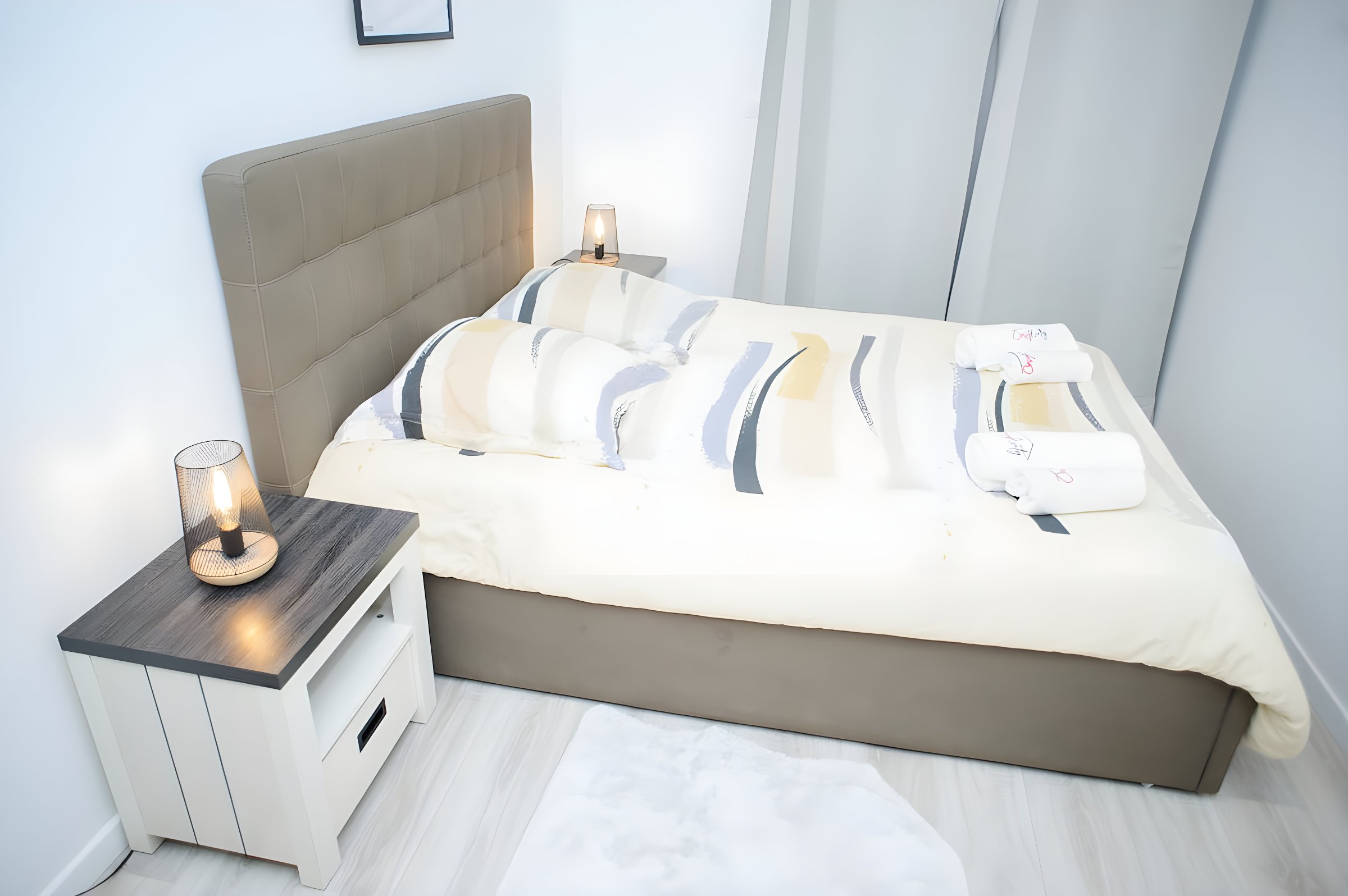 Bedroom perspective with double bed and bedside table