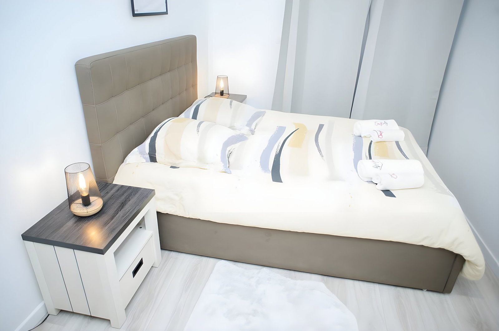 Bedroom perspective with double bed and bedside table