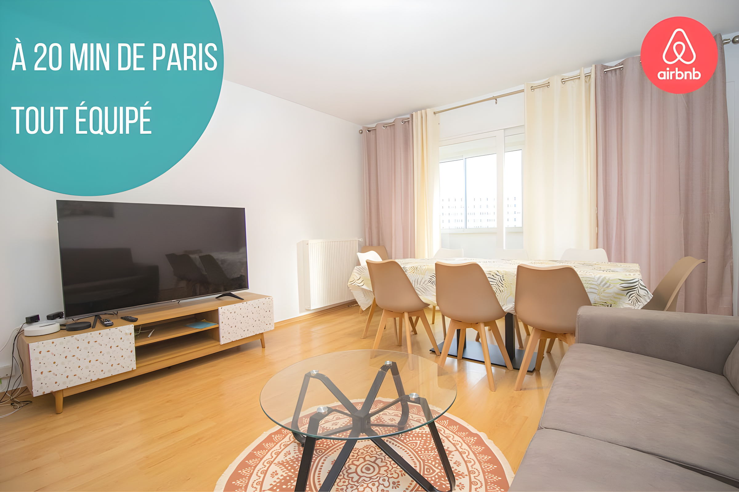 bright living room with large TV and dining area