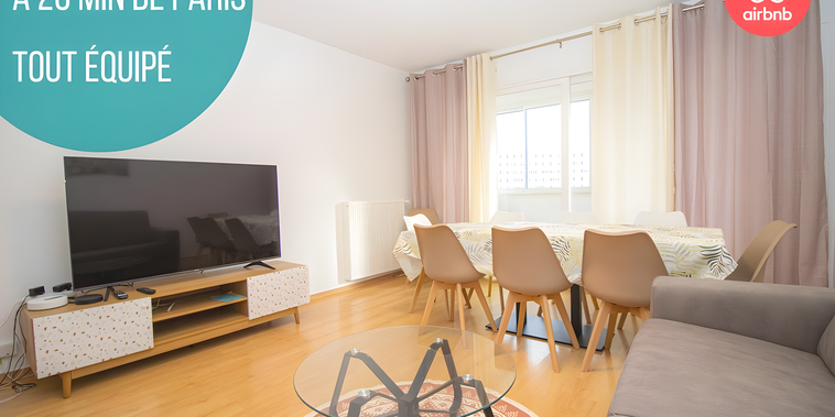 bright living room with large TV and dining area