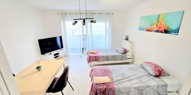 Flexible living room in large double bedroom with balcony