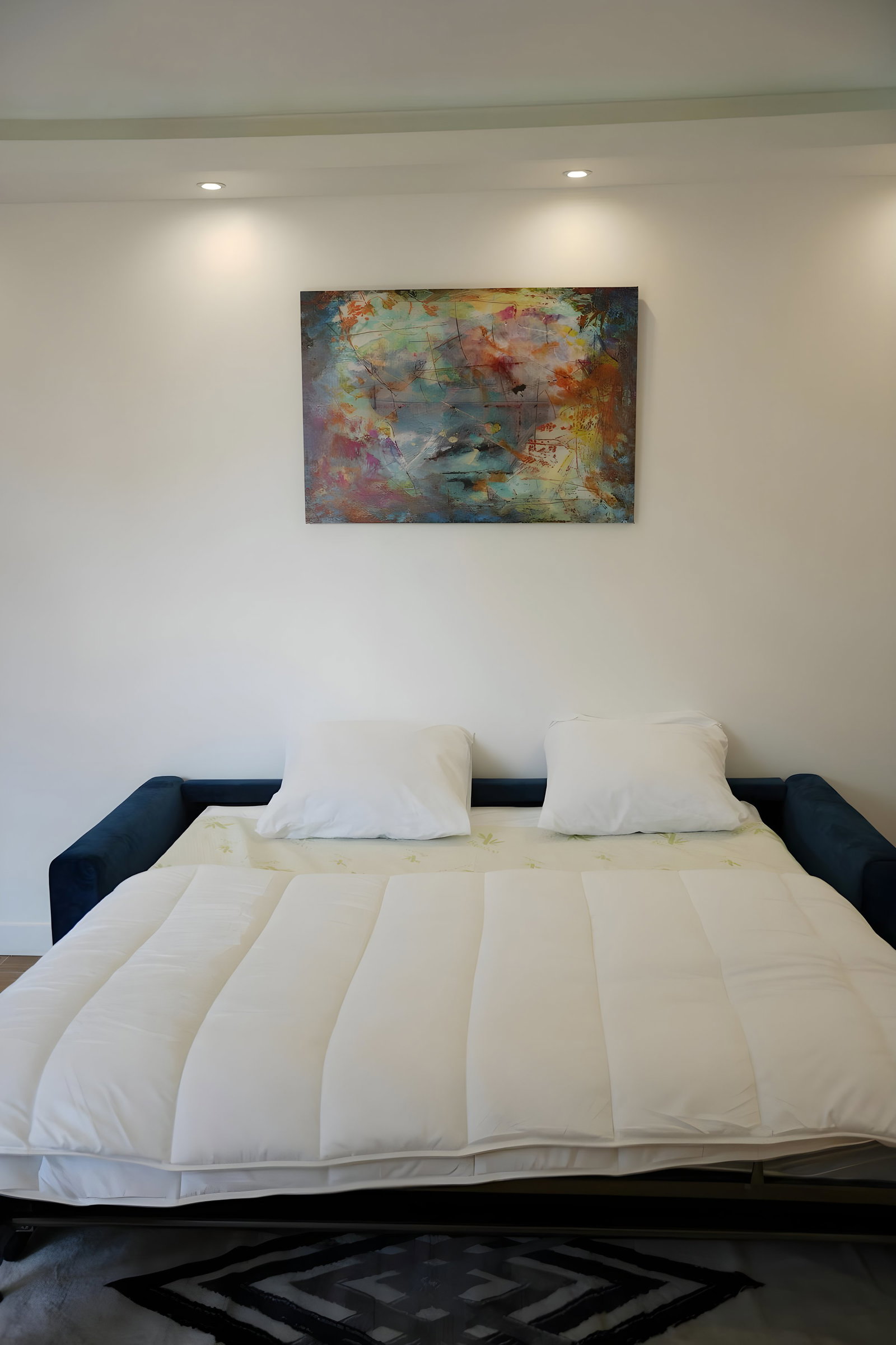 Rest on a spacious sofa bed with a very high quality mattress for peaceful and restorative nights. #ComfortMaximal #GrandeurNature #NuitsReconfortantes.