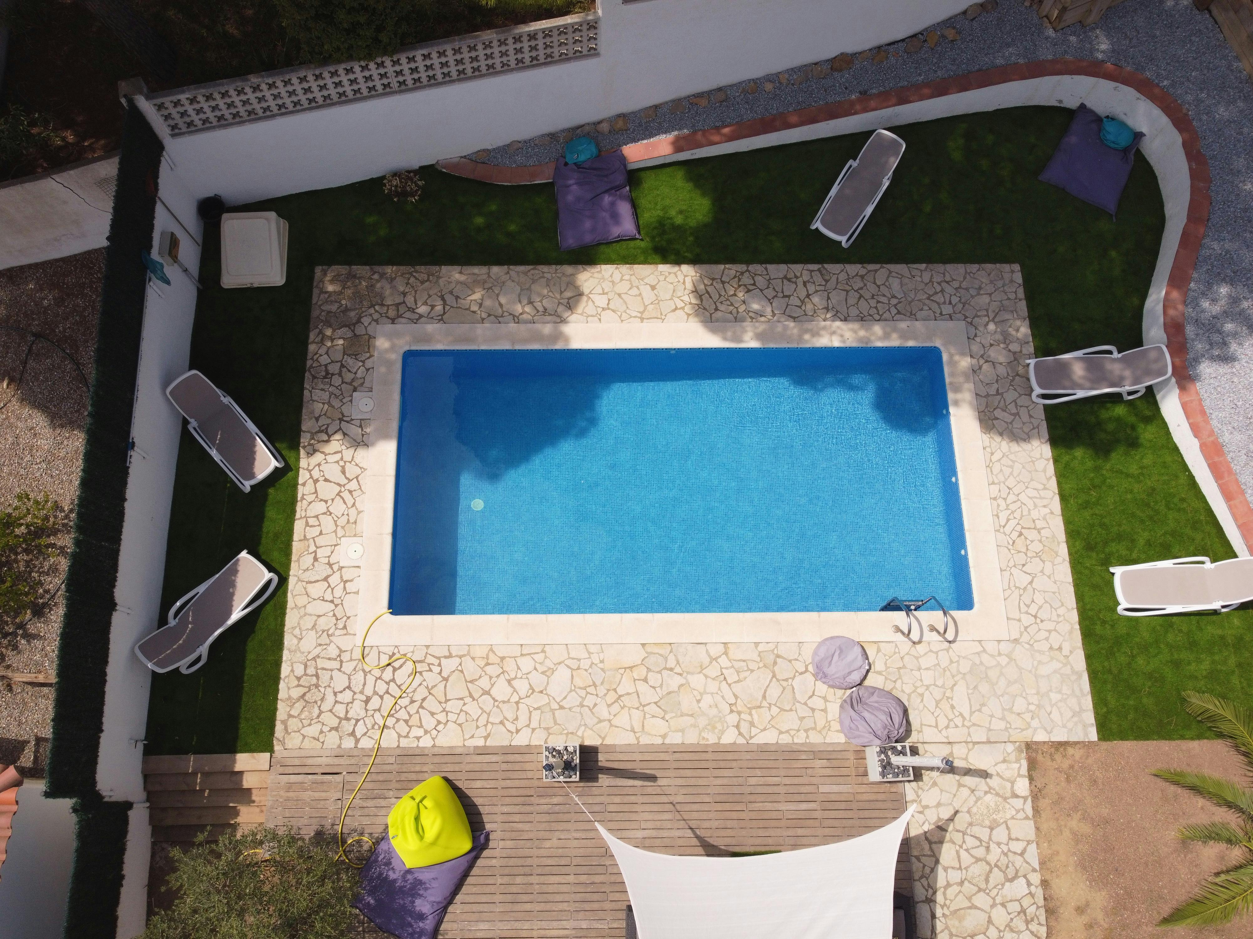 Birds view of the back garden with it's private pool.