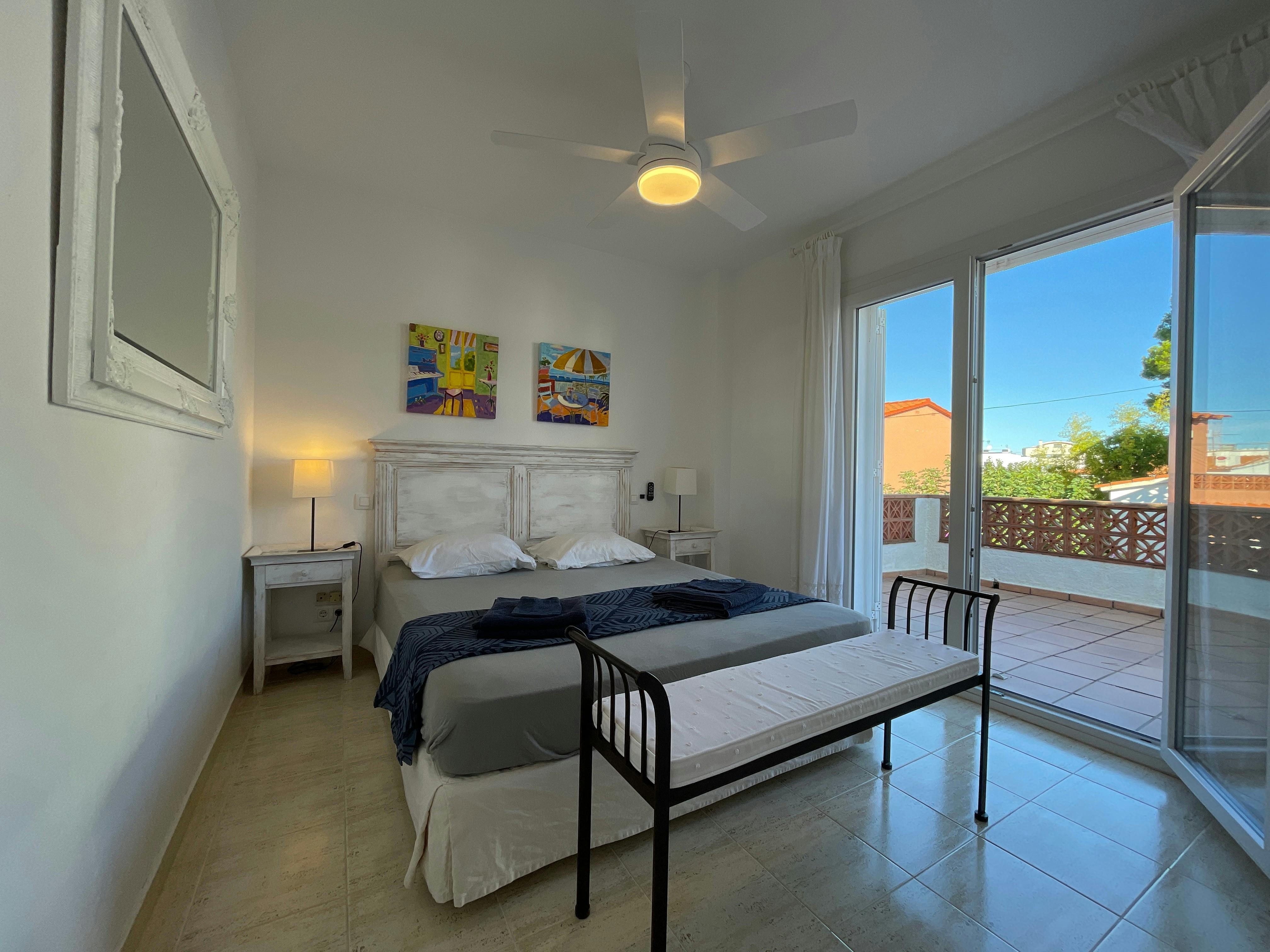 There's a big bedroom upstairs with a balcony. You can see the pool from it.