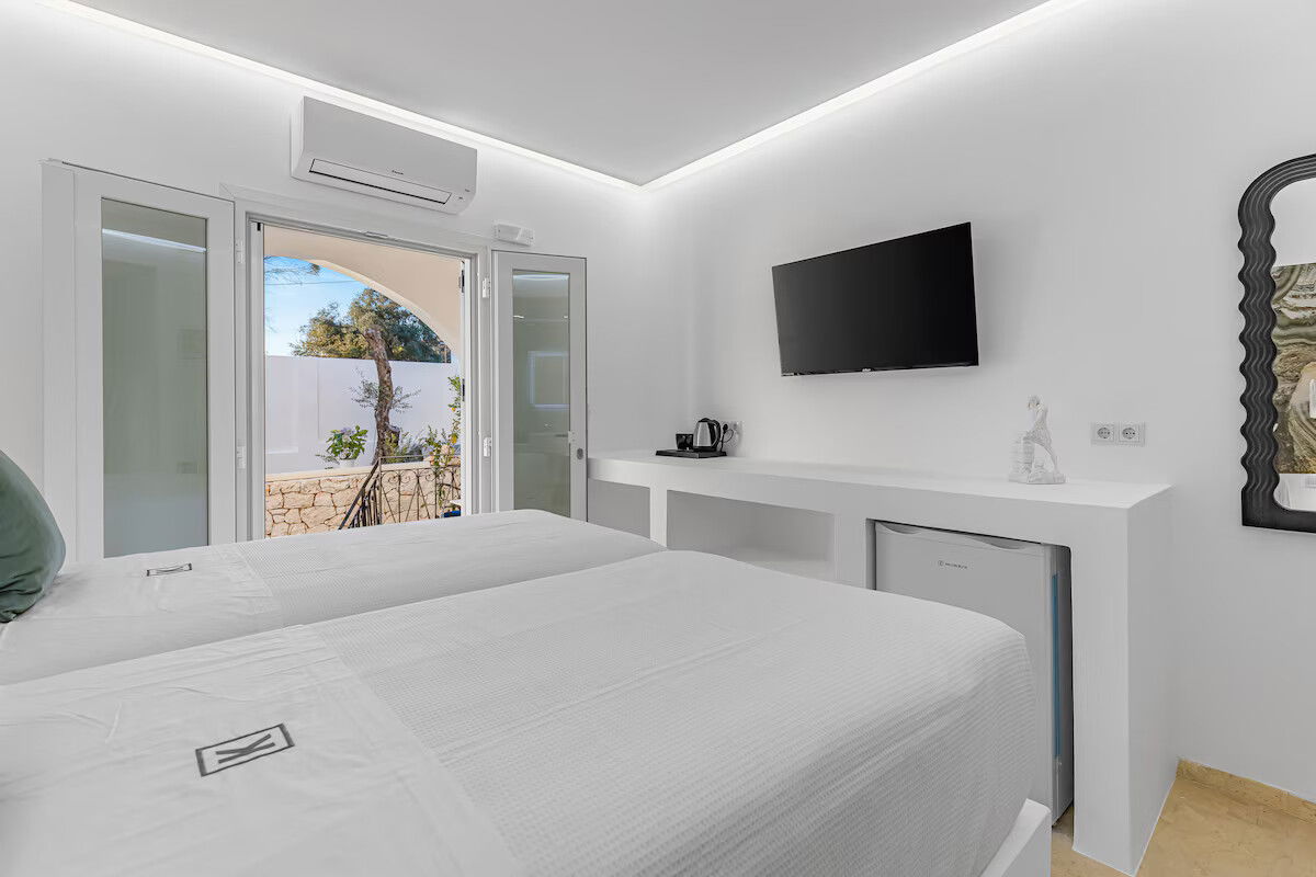 Enjoy garden views and boutique comfort in the Hephaestus Room at Villa K 🌿