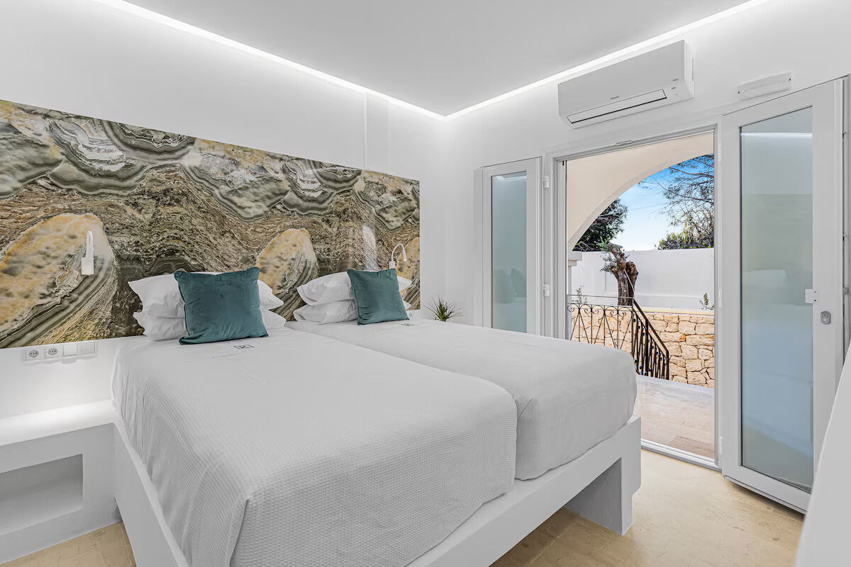 Enjoy garden views and boutique comfort in the Hephaestus Room at Villa K 🌿